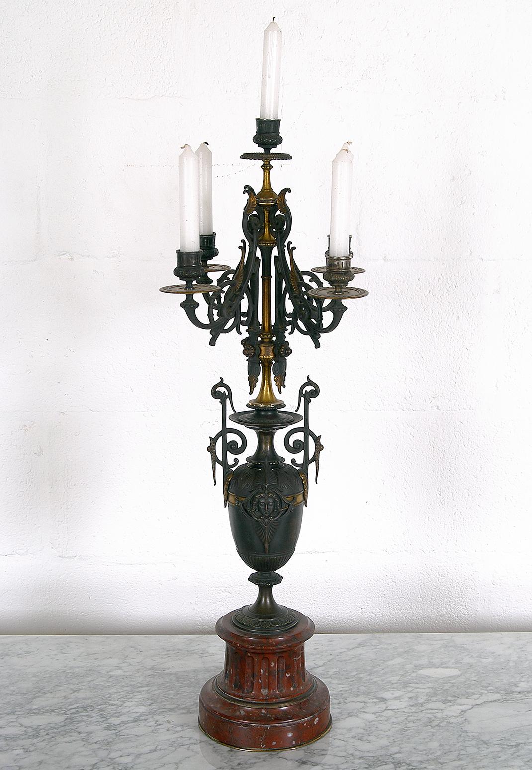 Wonderfully ostentatious urn shaped candelabra made of gilt and patinated bronze, raised on a red Languedoc marble support, which holds five candles with Classic effortless style, 19th century.
In good original condition, and ready to grace your