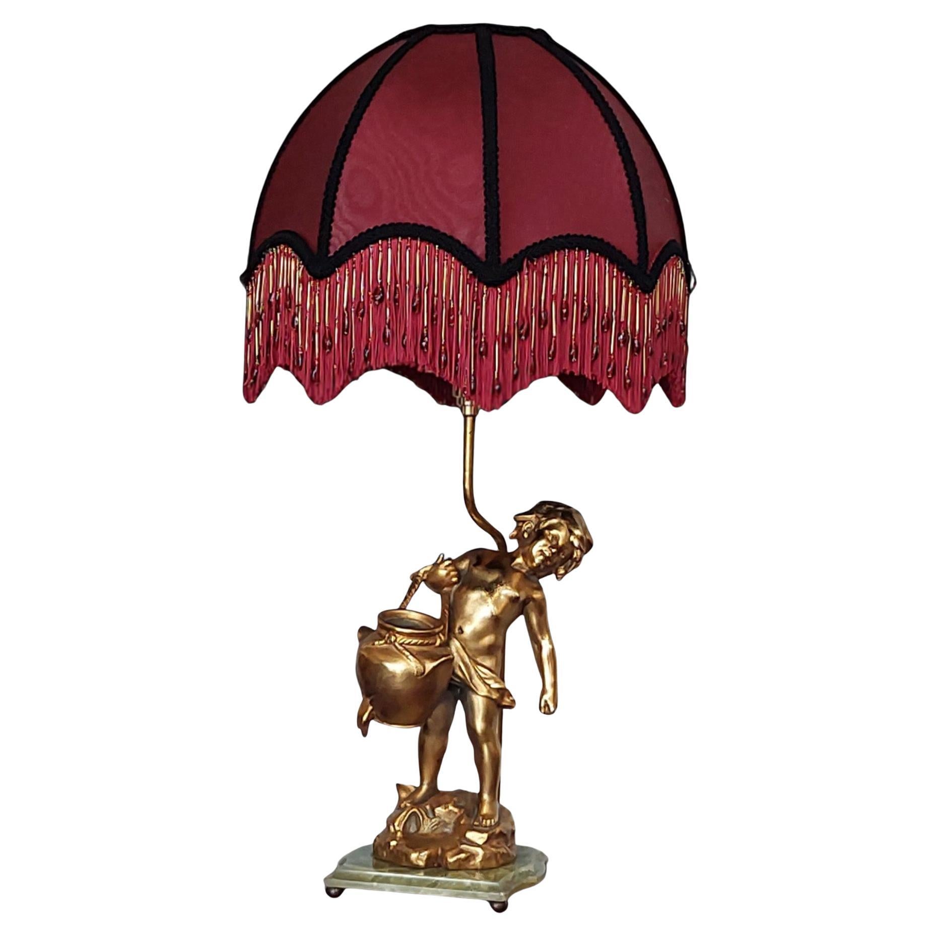 Base per lampada figurativa in bronzo dorato francese del XIX secolo