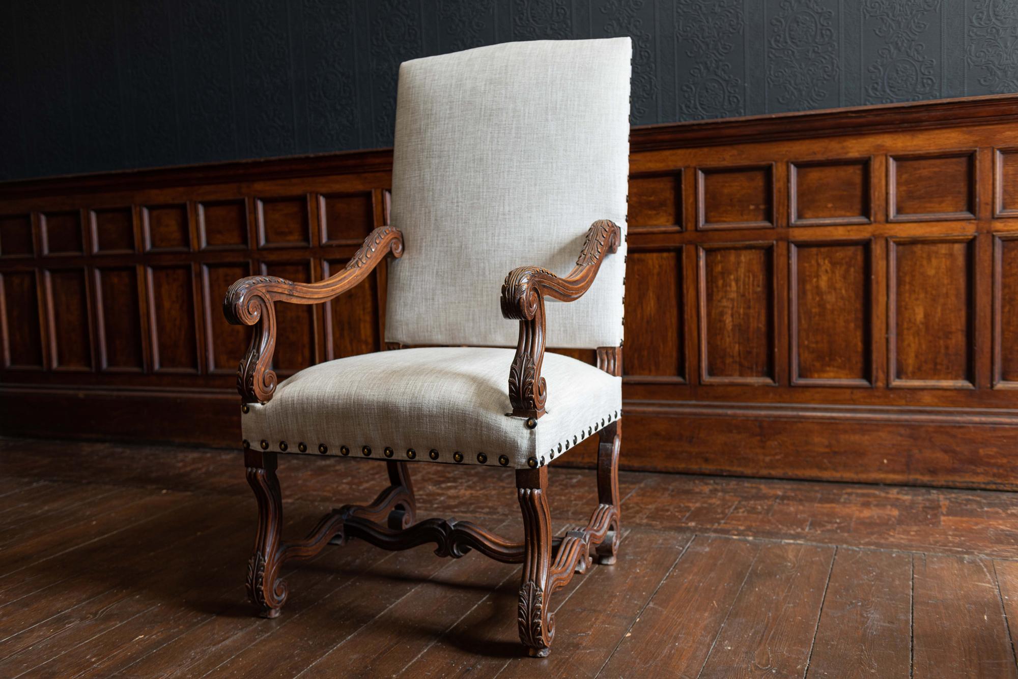 19th century French mahogany Louis XIV style armchair reupholstered in linen,
circa 1840.

Mahogany carved frame with excellent scrolled acanthus leaf detailing.
Upholstered in neutral linen and finished with large brass studs.

Sourced in the