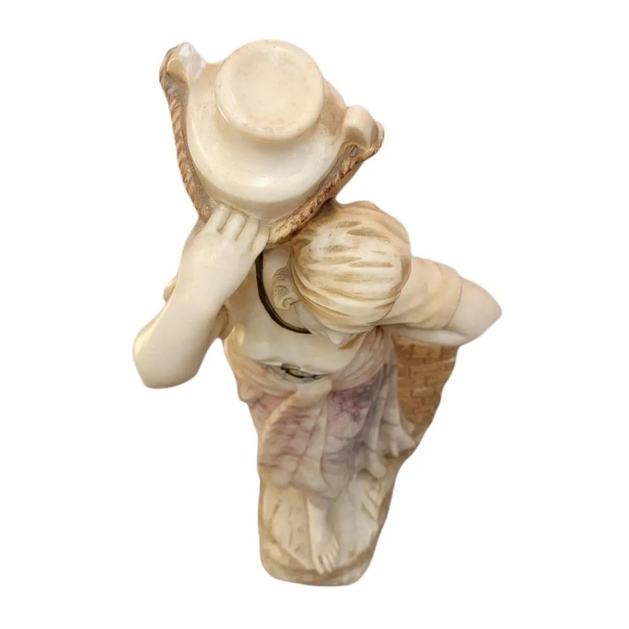 19thc Hand carved marble alabaster figural woman statue holding up a vase/canister bare foot in traditional working garments. Heavy base. Heavy item.