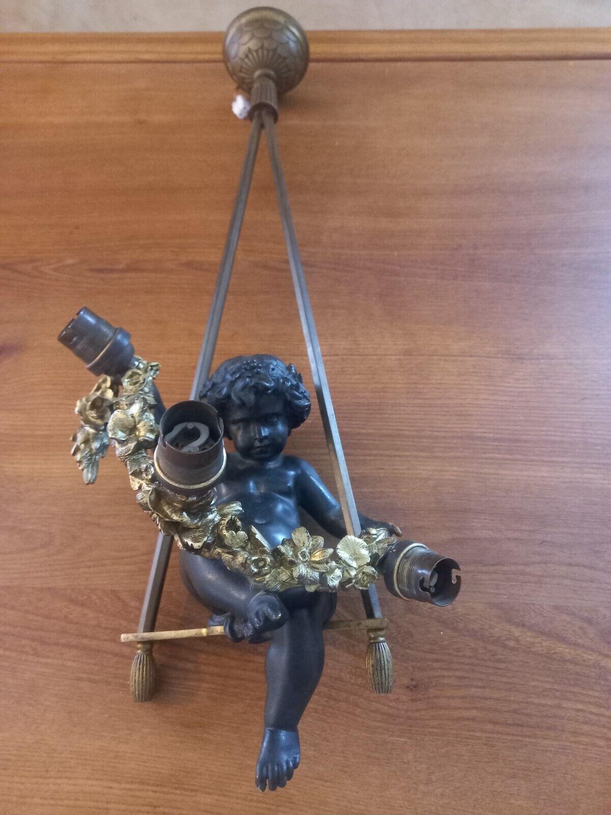 Stunning and Very High Quality. 19thc French Napoleon Gilt & Patinated Bronze Cherub Baby on His Swing and Carrying a Garland Chandelier. I cannot emphasize the superb quality of the casting. 3 light. This is a very special chandelier.