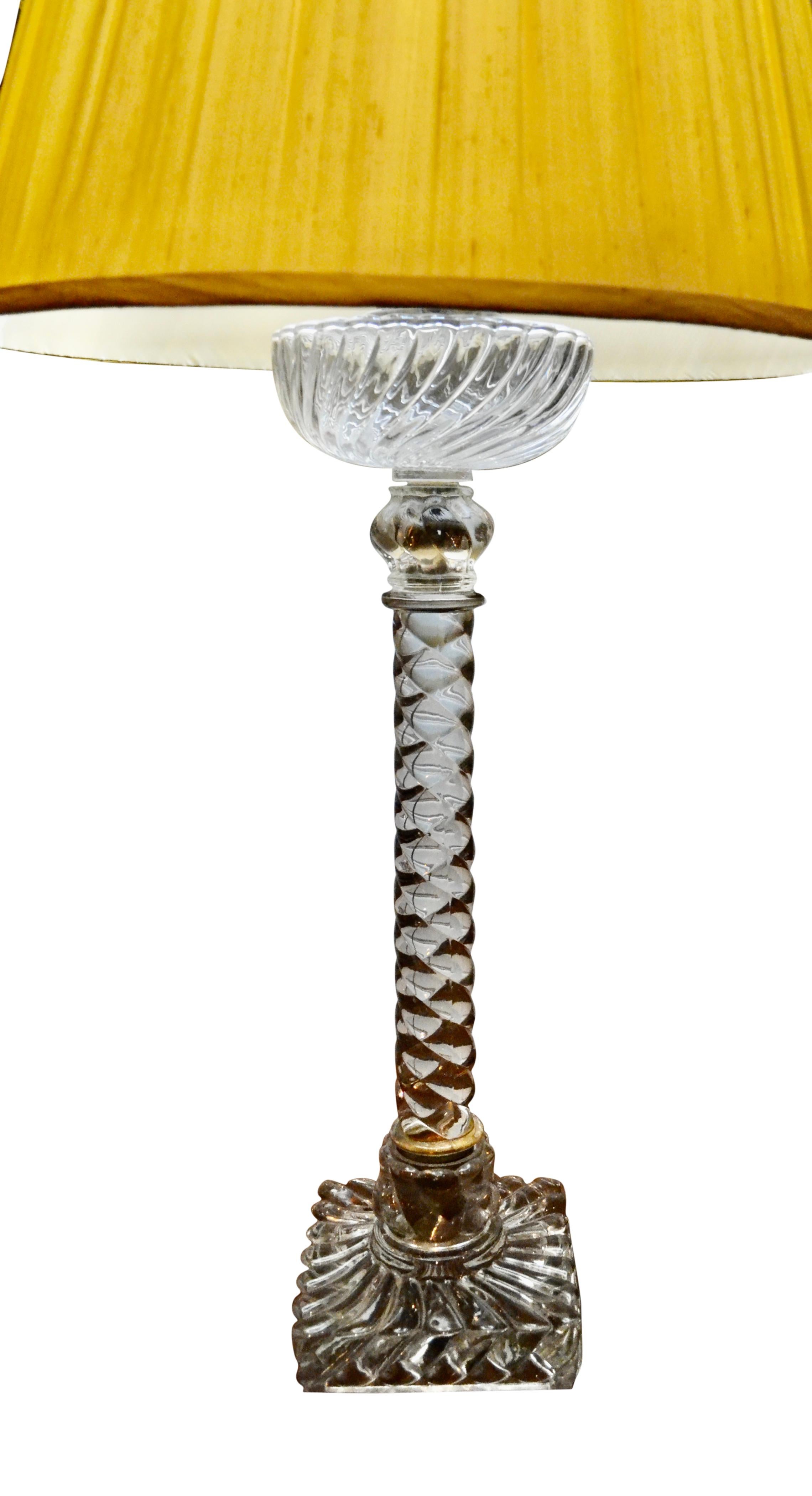 A late 19th century French crystal lamp by the famous Paris Baccarat company in the design referred to as 'rope twist'. There are five crystal components that make up the lamp. The cast crystal rectangular base supports the 'rope twist' central stem