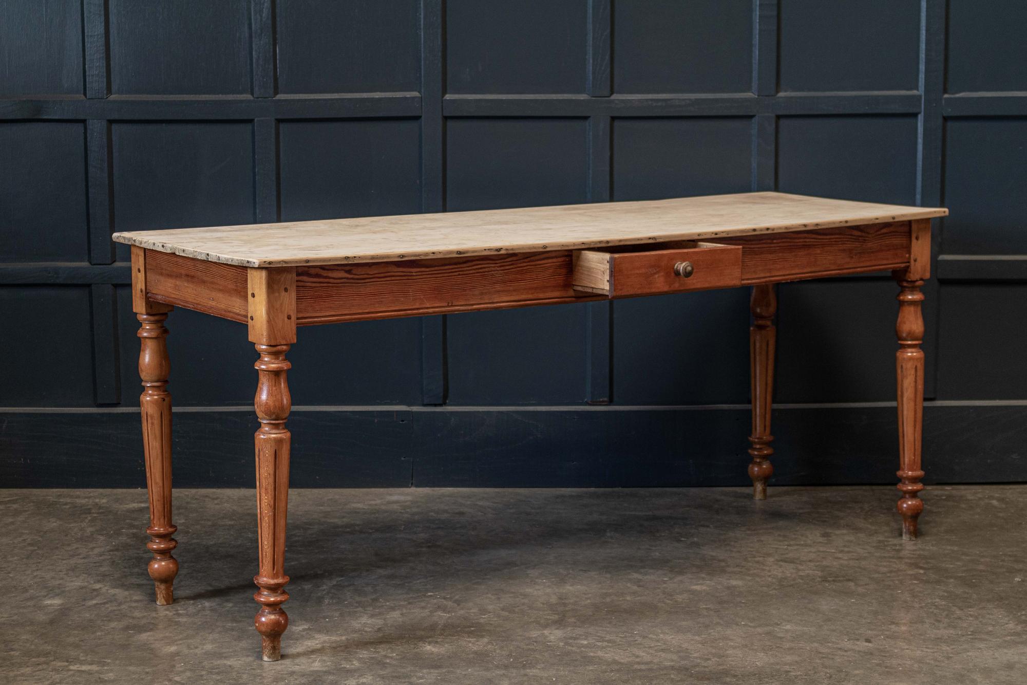 Circa 1870.

19thC French scrub top table, with fruitwood top, central drawer, elegant pegged fluted legs.

A versatile slim table, suitable as a server, console table, dining table or desk.

sku 751B

Measures: W 173 x D 59 x H 74.5cm.