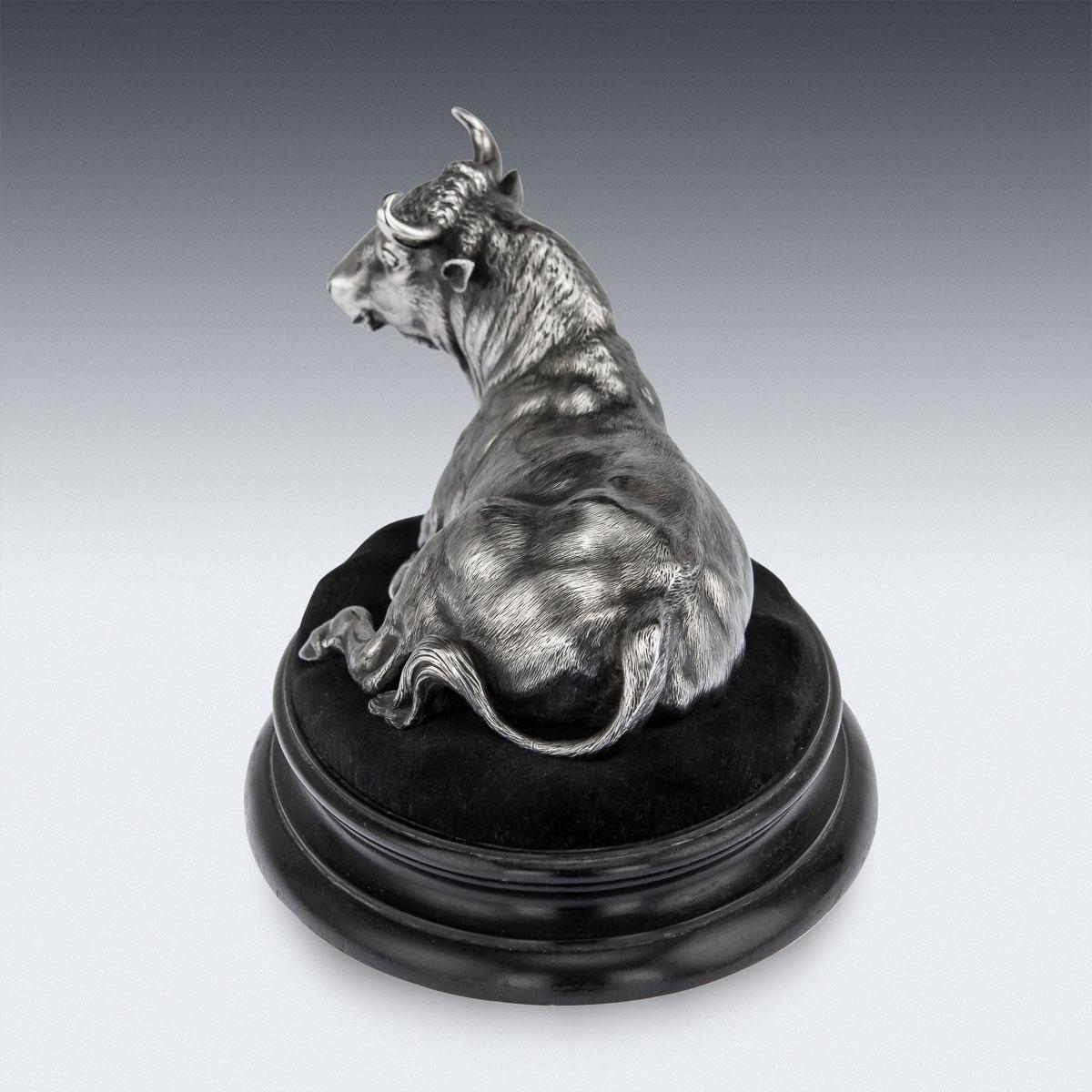 Antique 19th Century French solid silver figural statue, beautifully modelled depicting a resting bull on an ebony base. The sculptural figure is modelled to the highest quality, undoubtedly by one of the best French sculptors and silversmiths of