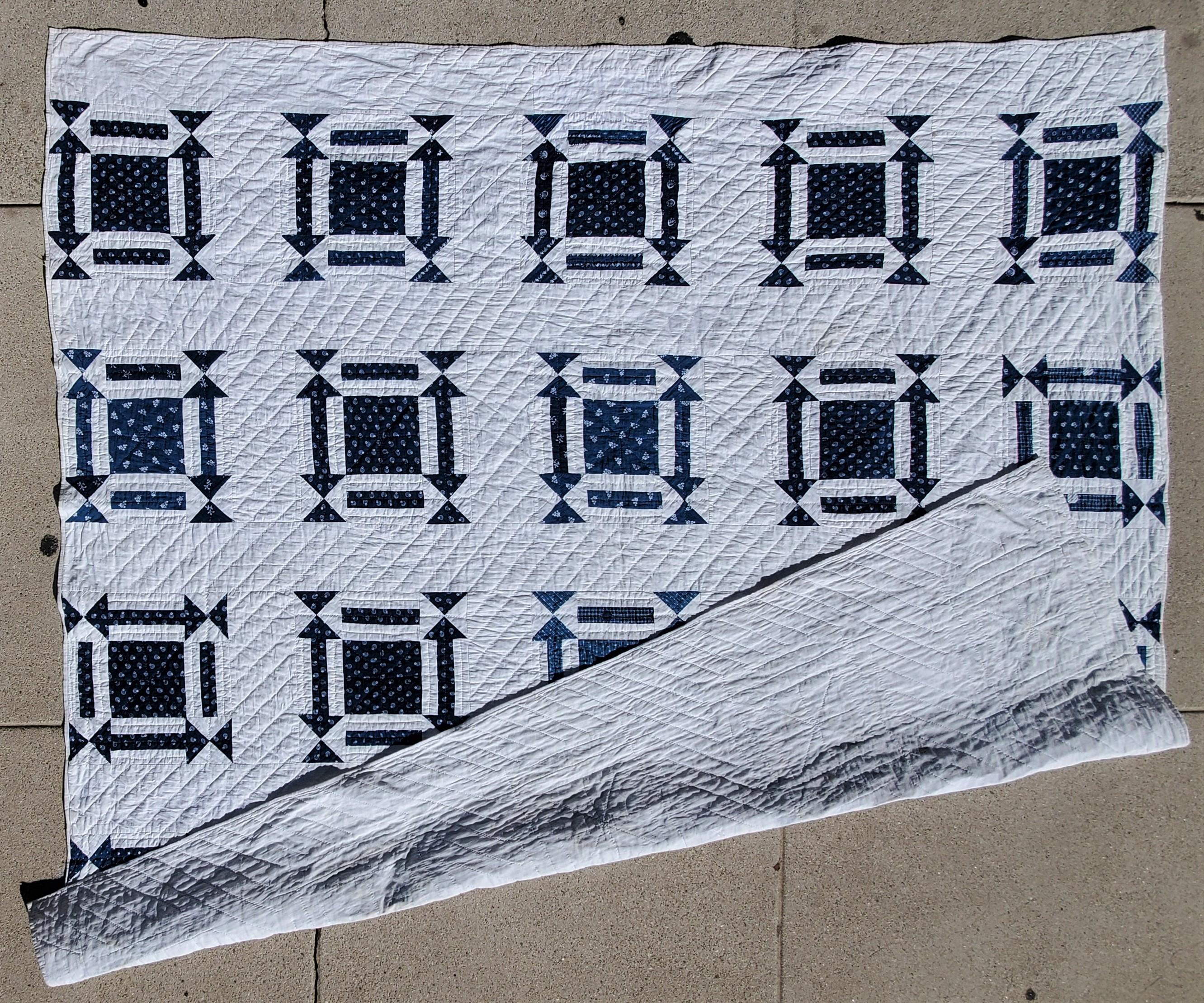 This is a fun geometric blue & white quilt with arrows and square surround. The condition is very good.