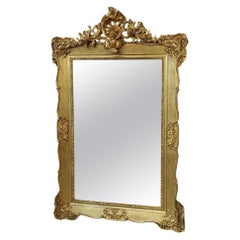 Miroir en bois sculpté et gesso doré du 19ème siècle