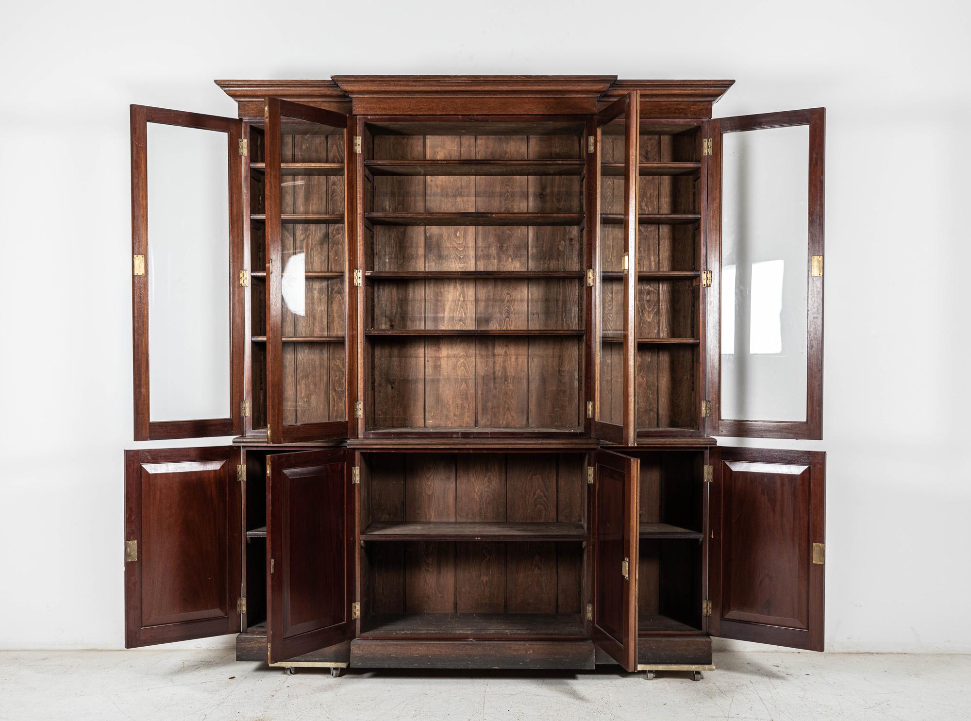 Circa 1890

19thC Glazed Mahogany Breakfront Bookcase

The projecting cornice above four glazed cupboard doors, enclosing adjustable shelves, above a base section with four fielded panel doors, raised on a plinth

sku 897B

H226 x W200 x D44 cm

Top