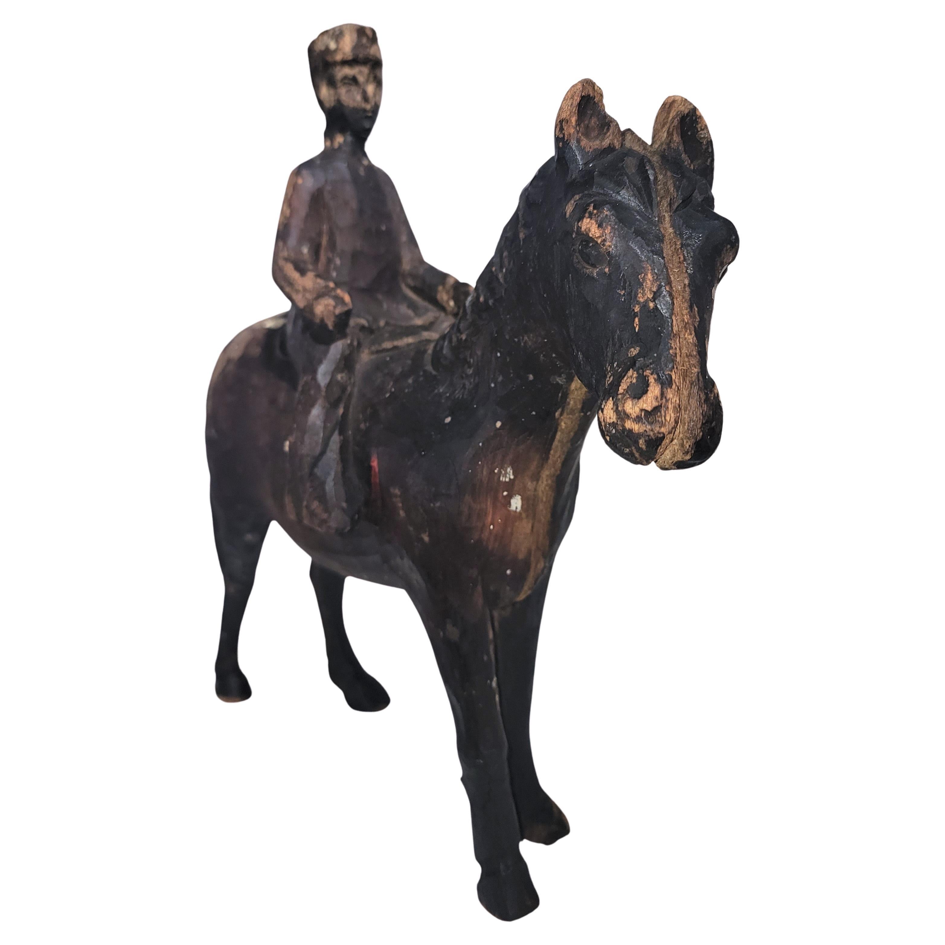 19Thc Hand carved horse and rider sculpture in amazing condition.This was found in a folk art collection in Arizona.The patina is wonderful and there are scrapes and wear consistent from age and use.
