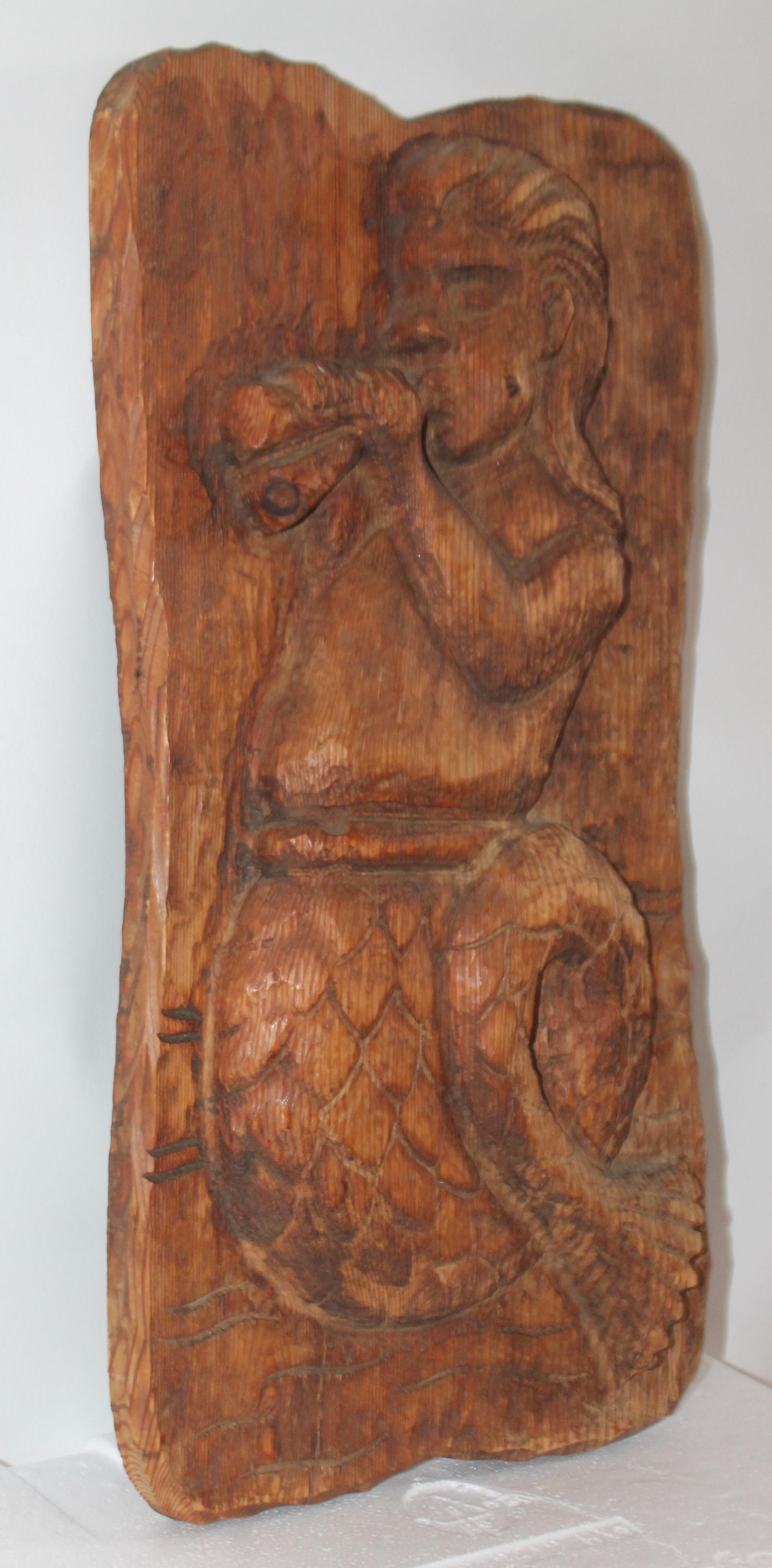 19th century wood hand carved mermaid plaque with great patina. This is in fine condition.