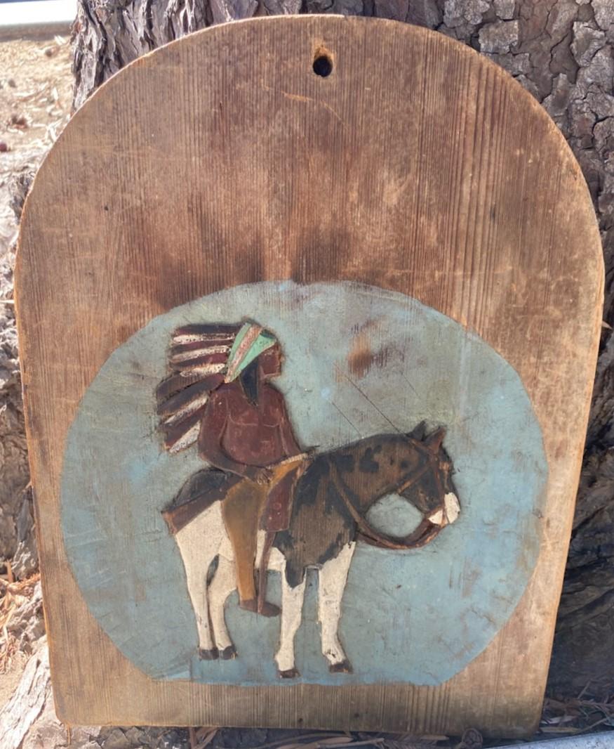 19th century hand carved and painted Indian on horseback on folky wall plaque.