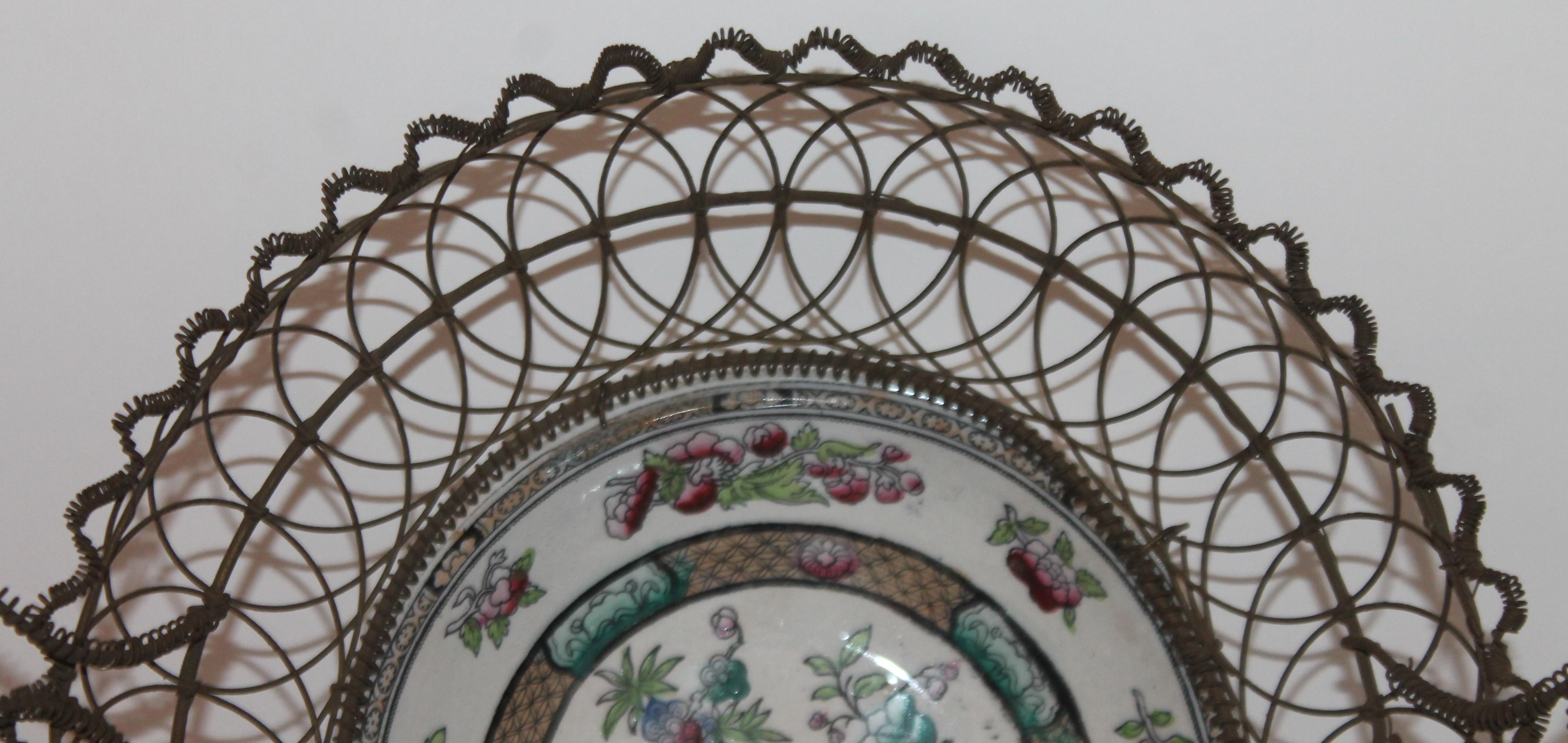 Edge. Malkin & Co standard printed trade mark used circa 1871-1891
Handmade 19th century wire basket with handles with a inserted bowl. Everything is in very good condition.