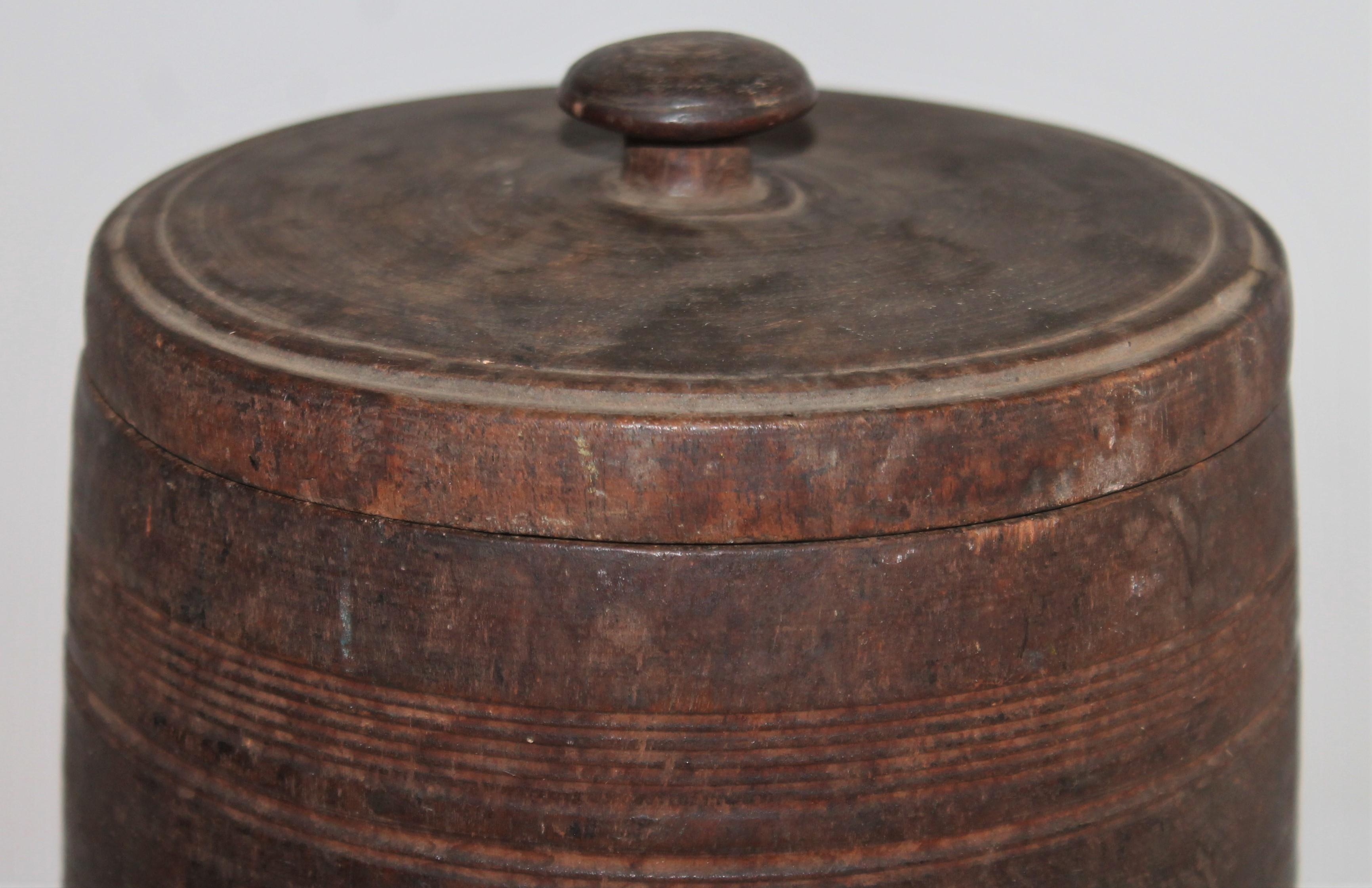 19th century handmade and carved wood canister from New England.