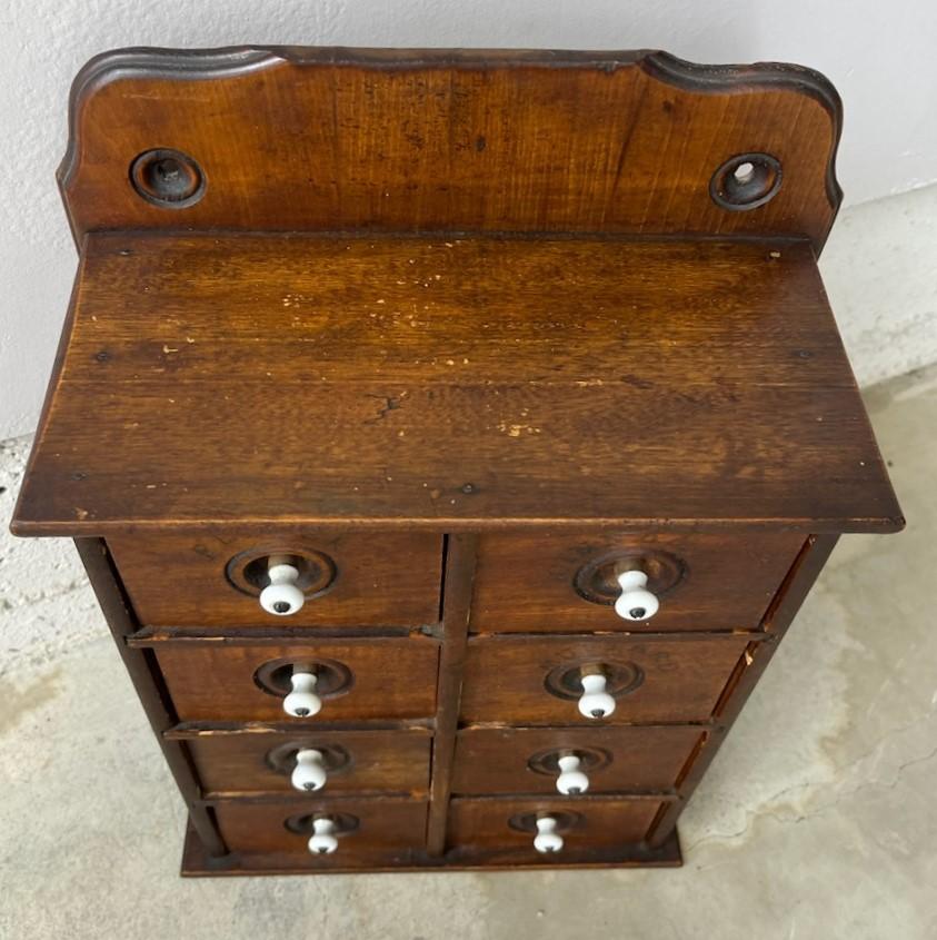 19Thc Stenciled wall hanging or counter spice box with stenciled spices on drawers.In amazing condition and has original porcelain drawer pulls all in pristine condition.This spice cabinet was found in Pennsylvania.