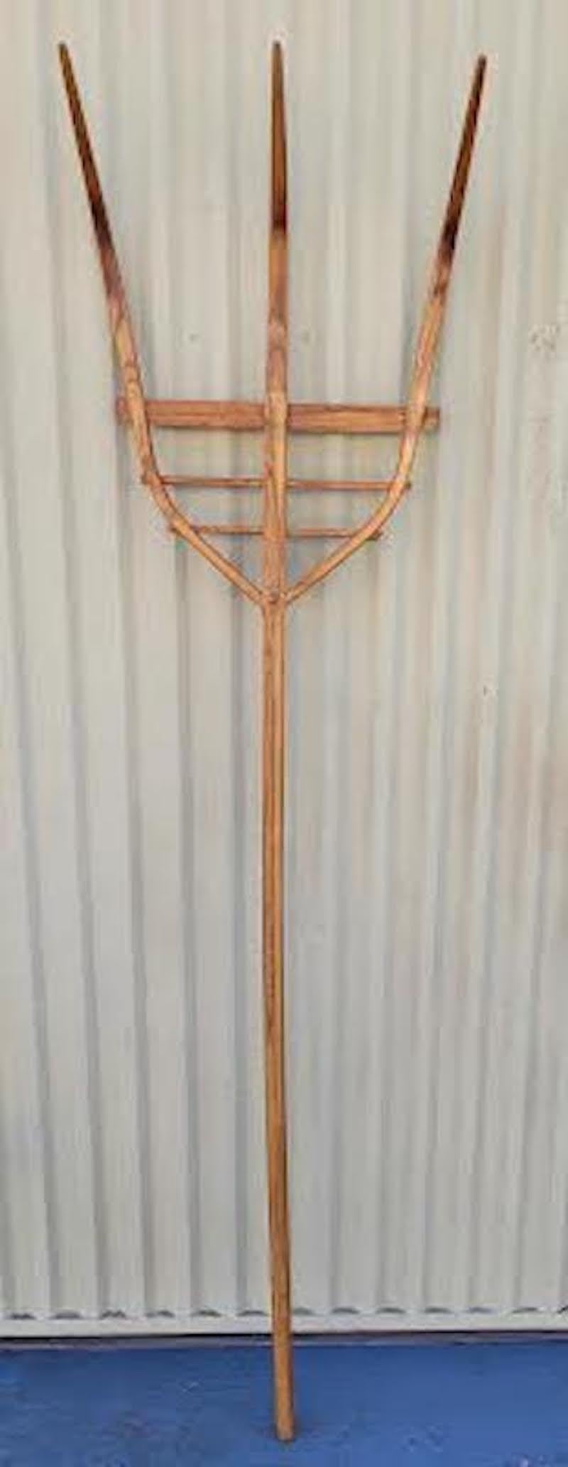 This hand carved and crafted hay fork was found in Pennsylvania on a farm.The condition is very good and sturdy.