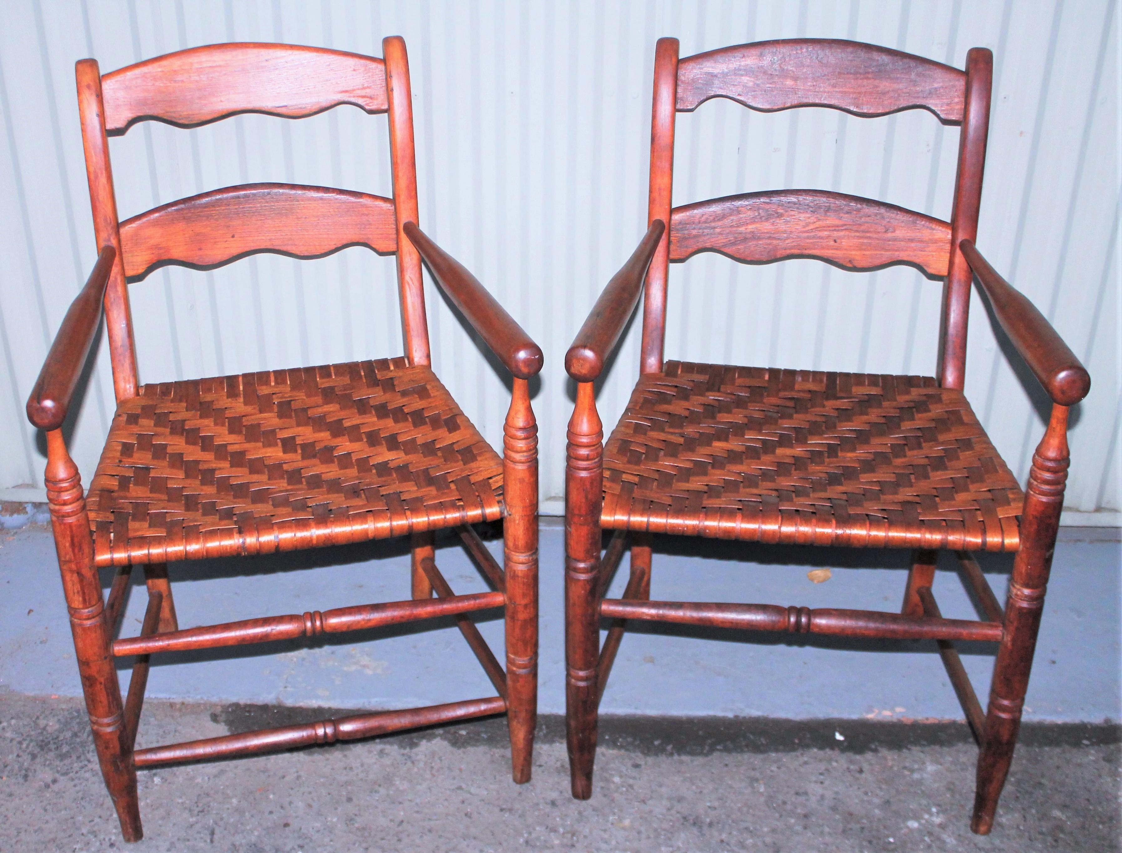 This fine pair of ladder back hickory chairs are in fine condition with a wonderful aged patina. They are in great condition and super comfortable. Sold as a perfect matched pair.