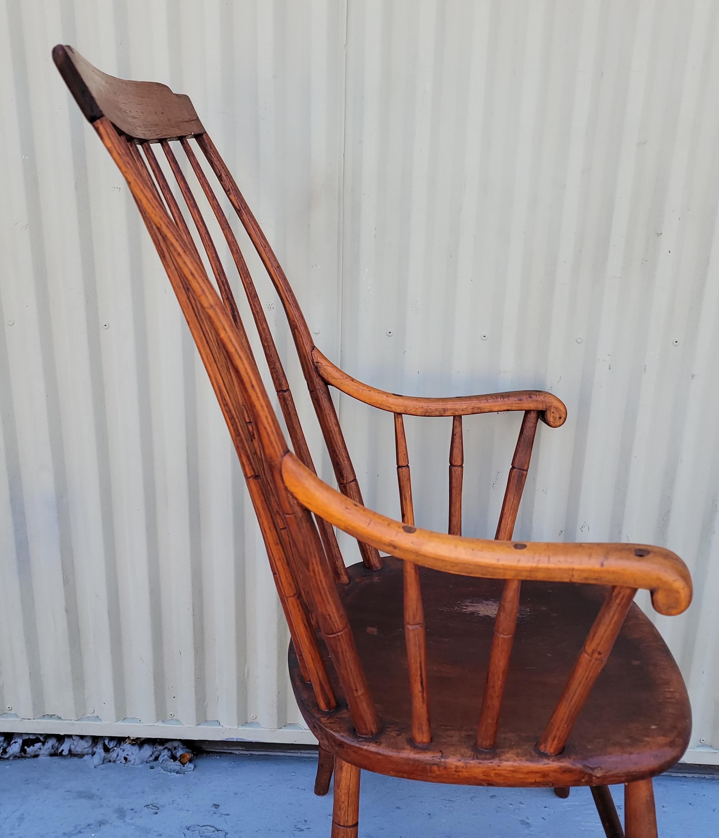 19th C High back Windsor New England arm chair is in fantastic condition and very comfortable. This fine chair has mortised & pegged arms & legs.The construction is fantastic.