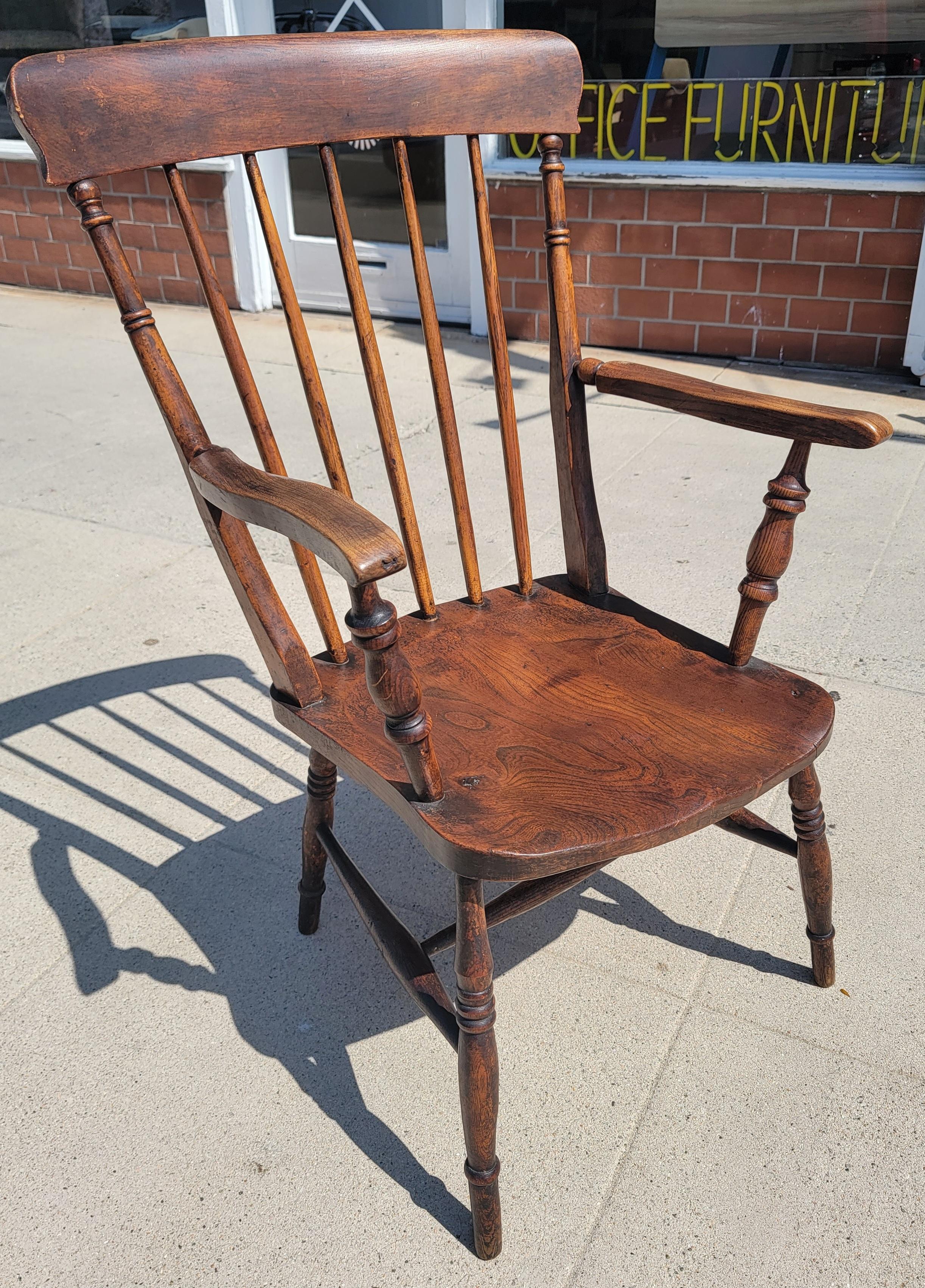19thc Plank seat Windsor arm chairs in fine condition and with an amazing patina.This arm chair was found in New England estate.