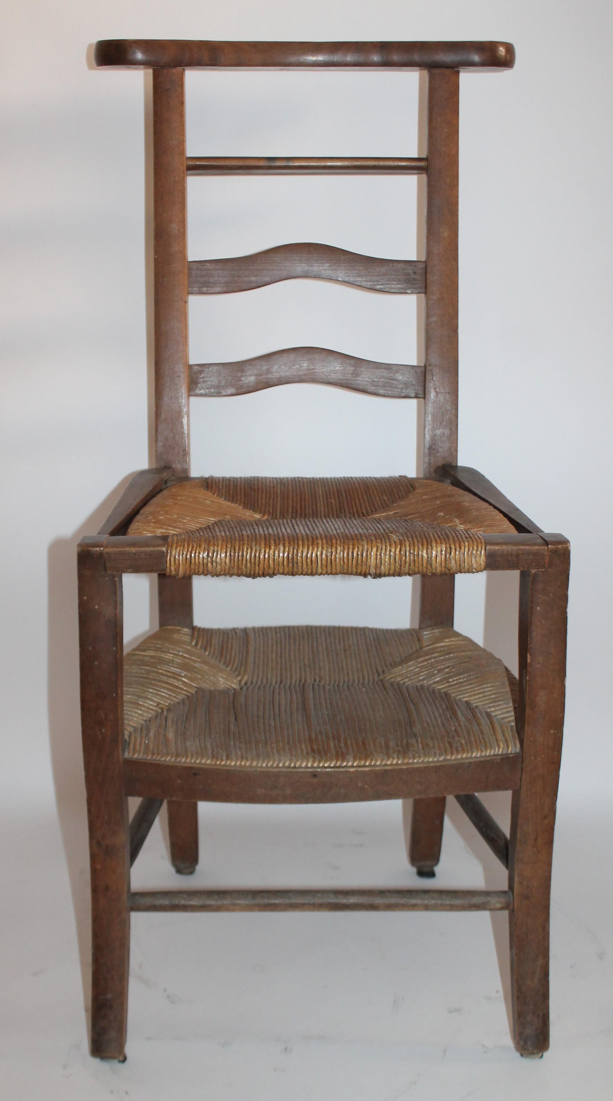 19th century lift top high chair for children with beautiful cane lift top seat.