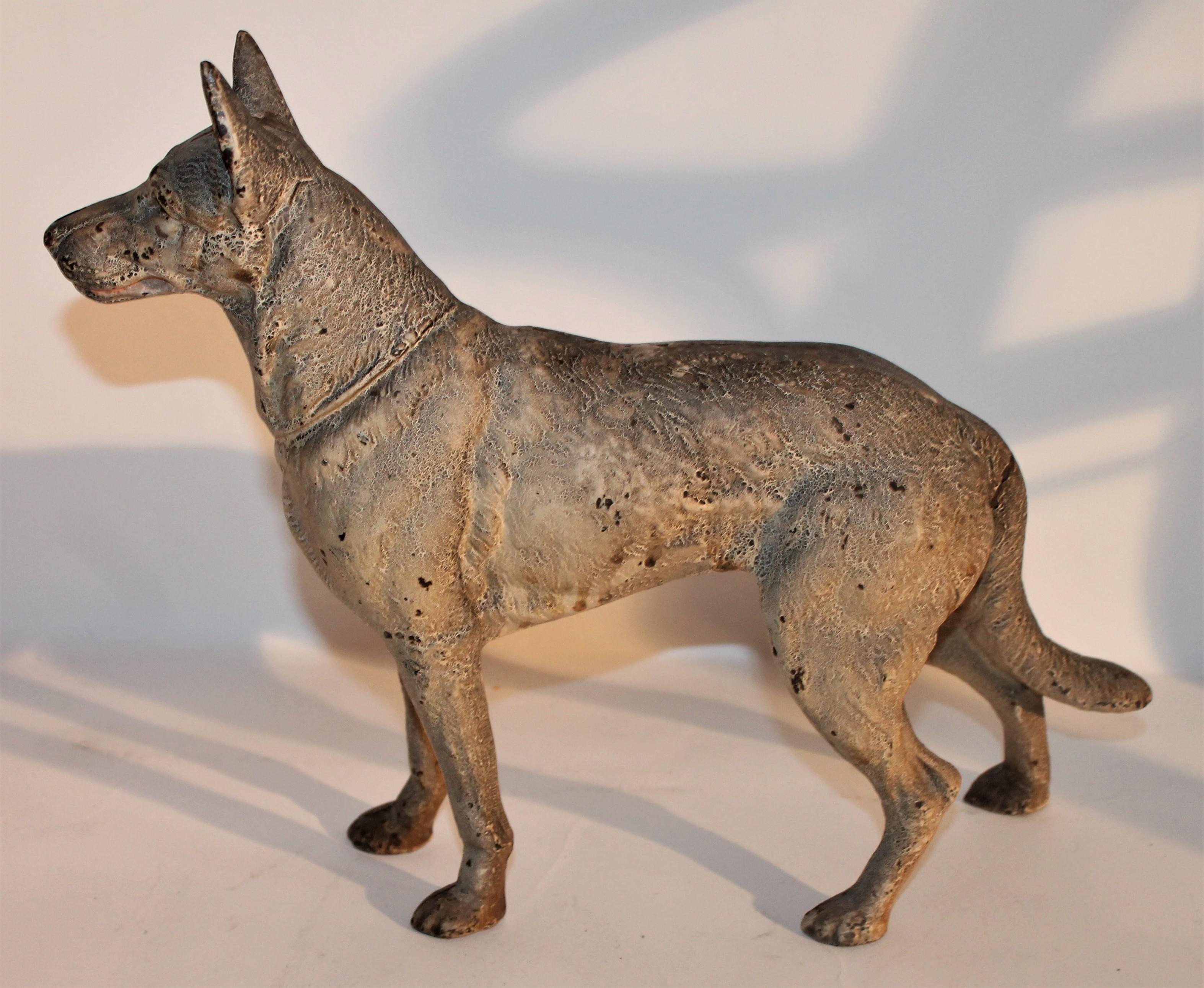 This fine all original painted 19th century German Shepard cast iron door stop is made by the Hubley and in fine untouched condition. These are so hard to find with such great surface.