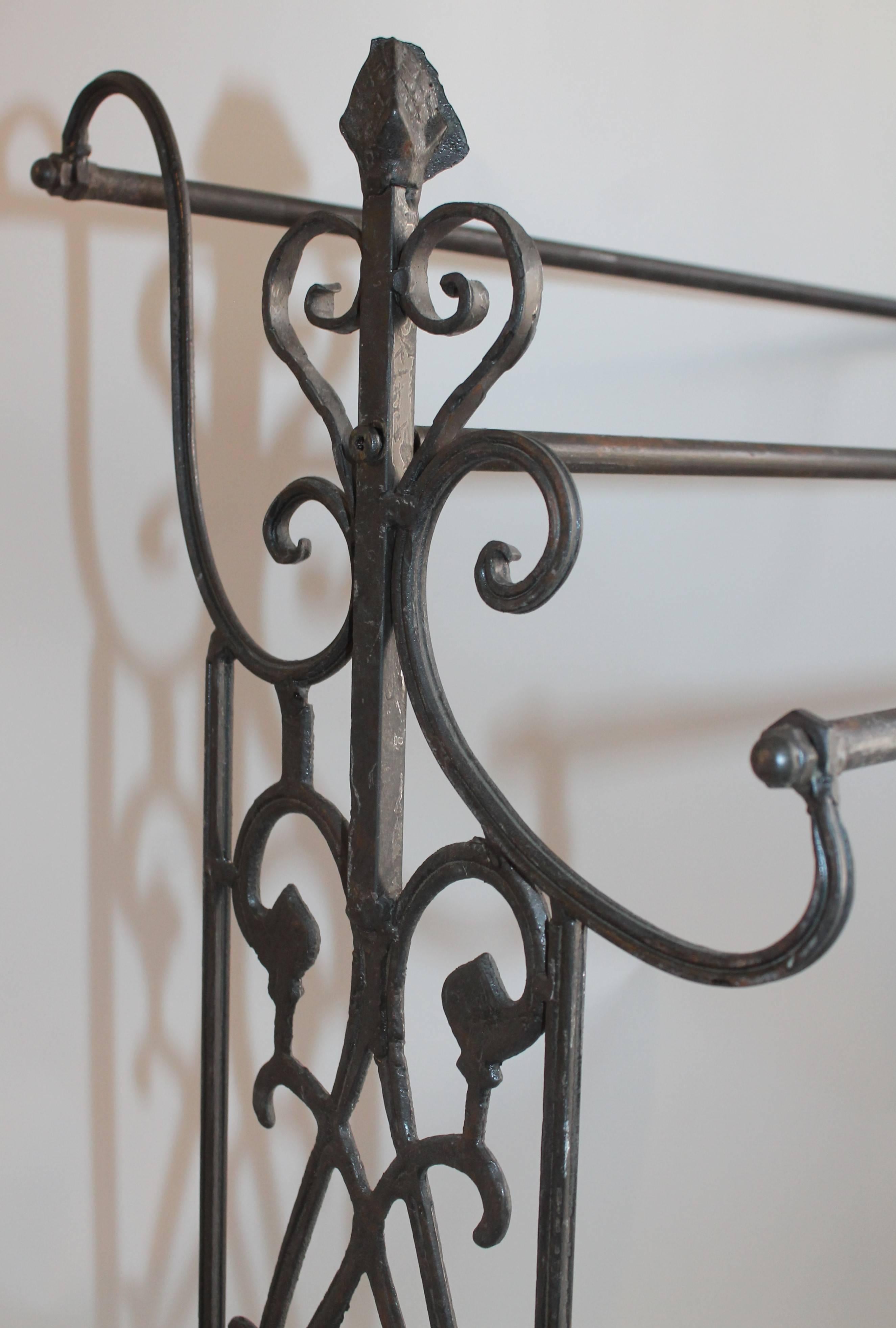 19th century iron quilt or blanket rack in nice condition. This sturdy and ornate rack works with any decor.