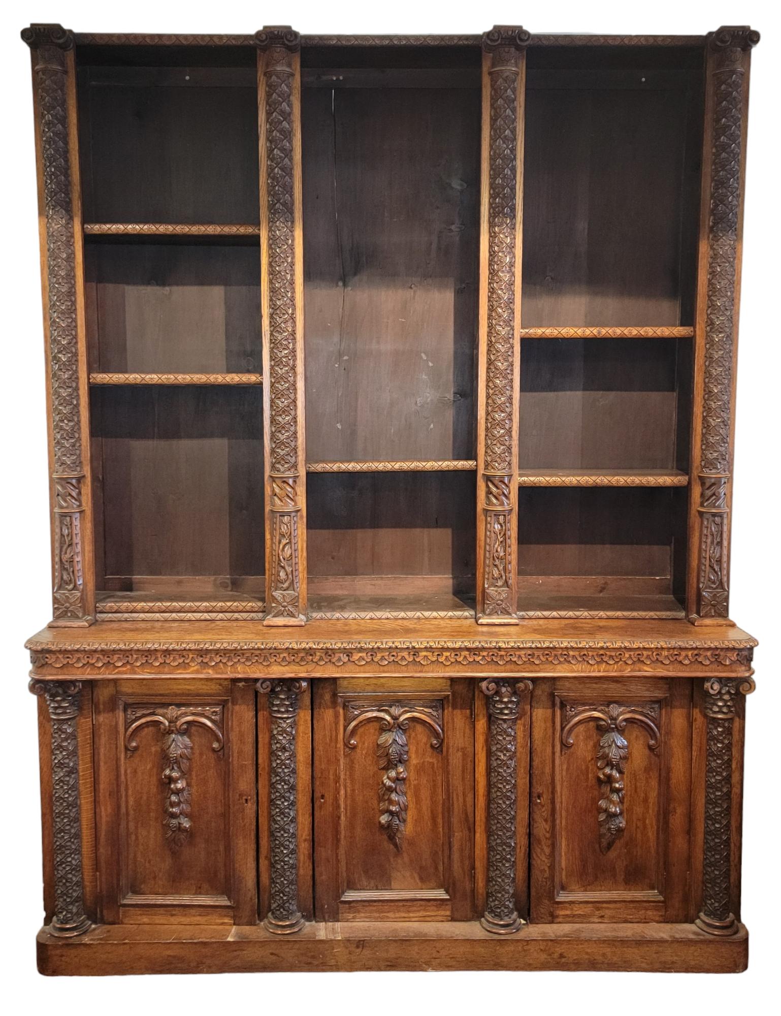 19thc Italian Hand Carved Bookcase Commode. The shelves are adjustable within the top half. The bottom half(commode area) has a three door cabinet style to them and house one shelving each. Lots of space with a great carved look. Measures approx -