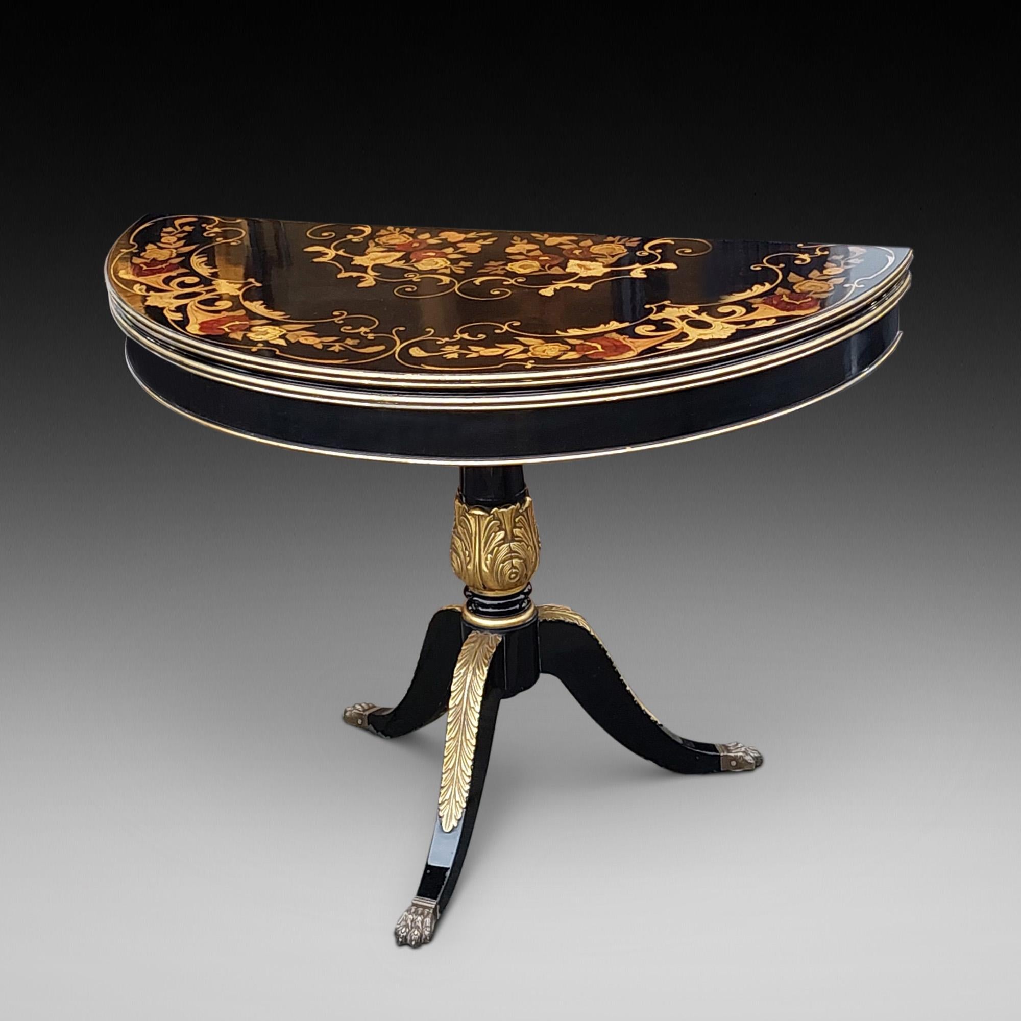 19thC Italian Parcel Gilt Marquetry Inlaid Ebonised Card Table - of Demi-Lune form and foldover top with tripod base - 42