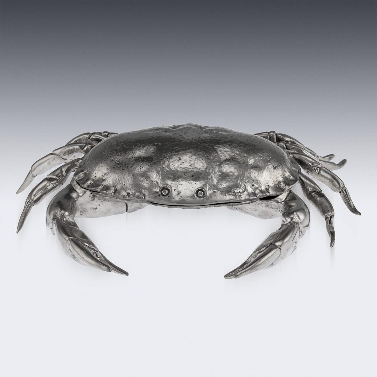 20th century Italian large and unusual caviar serving dish with a serving spoon, in the form of a crab, realistically modelled and textured, the top shell hinged onto a caviar dish, comes with a shell shaped caviar spoon. Hallmarked ETAIN 95%