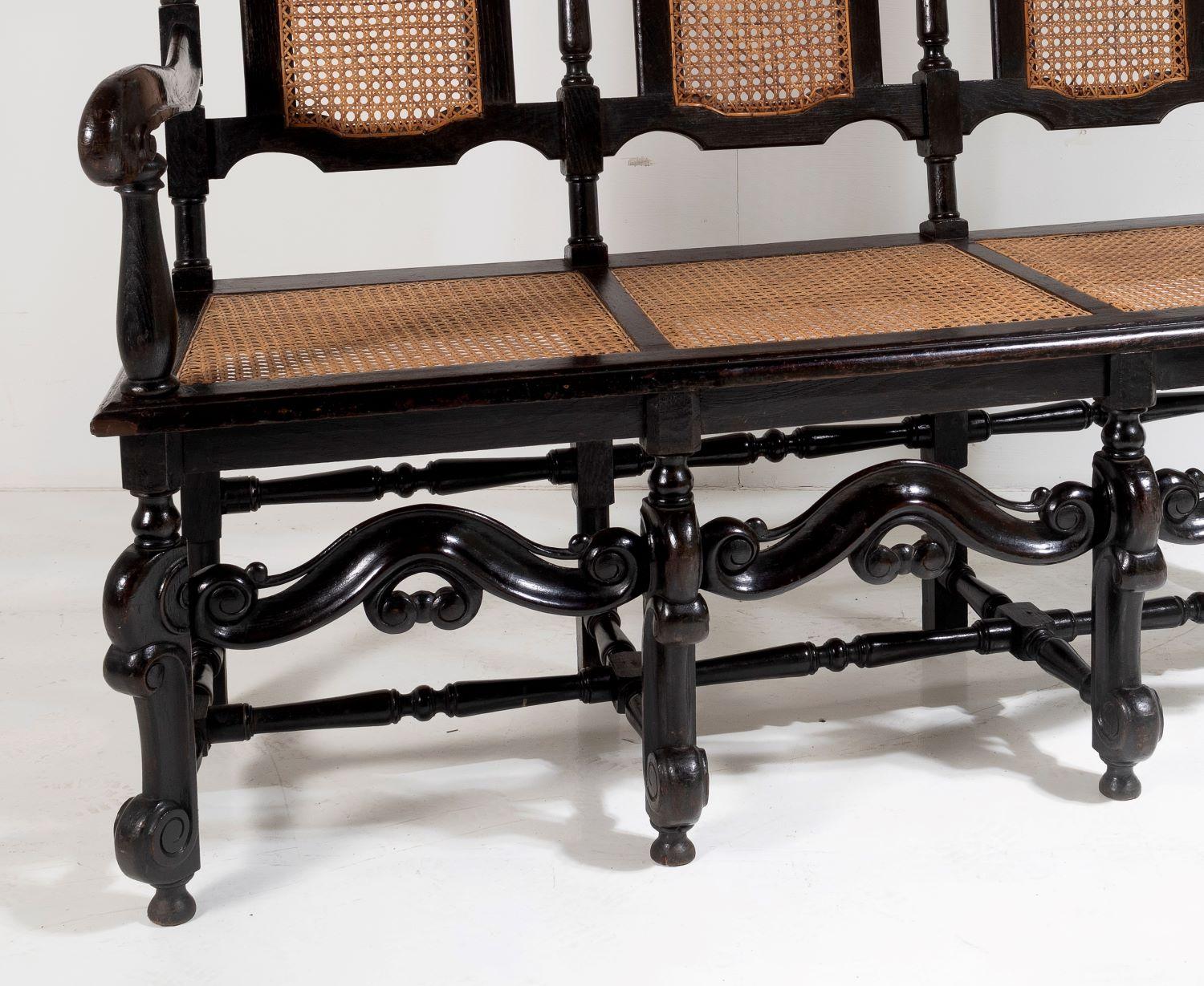 Hand-Crafted 19th C Jacobean Renaissance Carved Oak High Back Cane 3 Seater Hall Bench Settee For Sale
