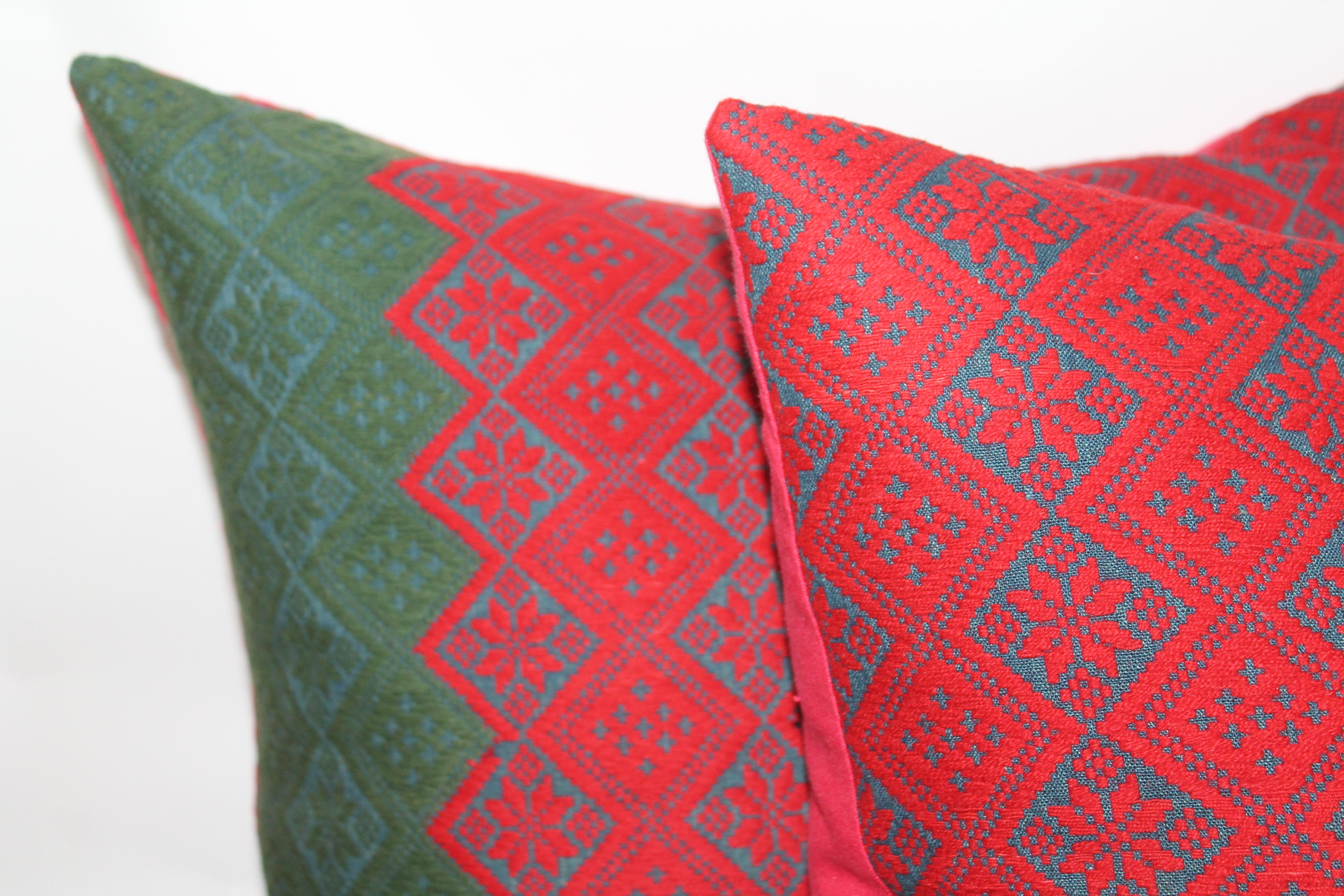 These amazing handwoven jacquard red and blue coverlet pillows have red cotton linen fabric on the backing. The condition is fantastic.