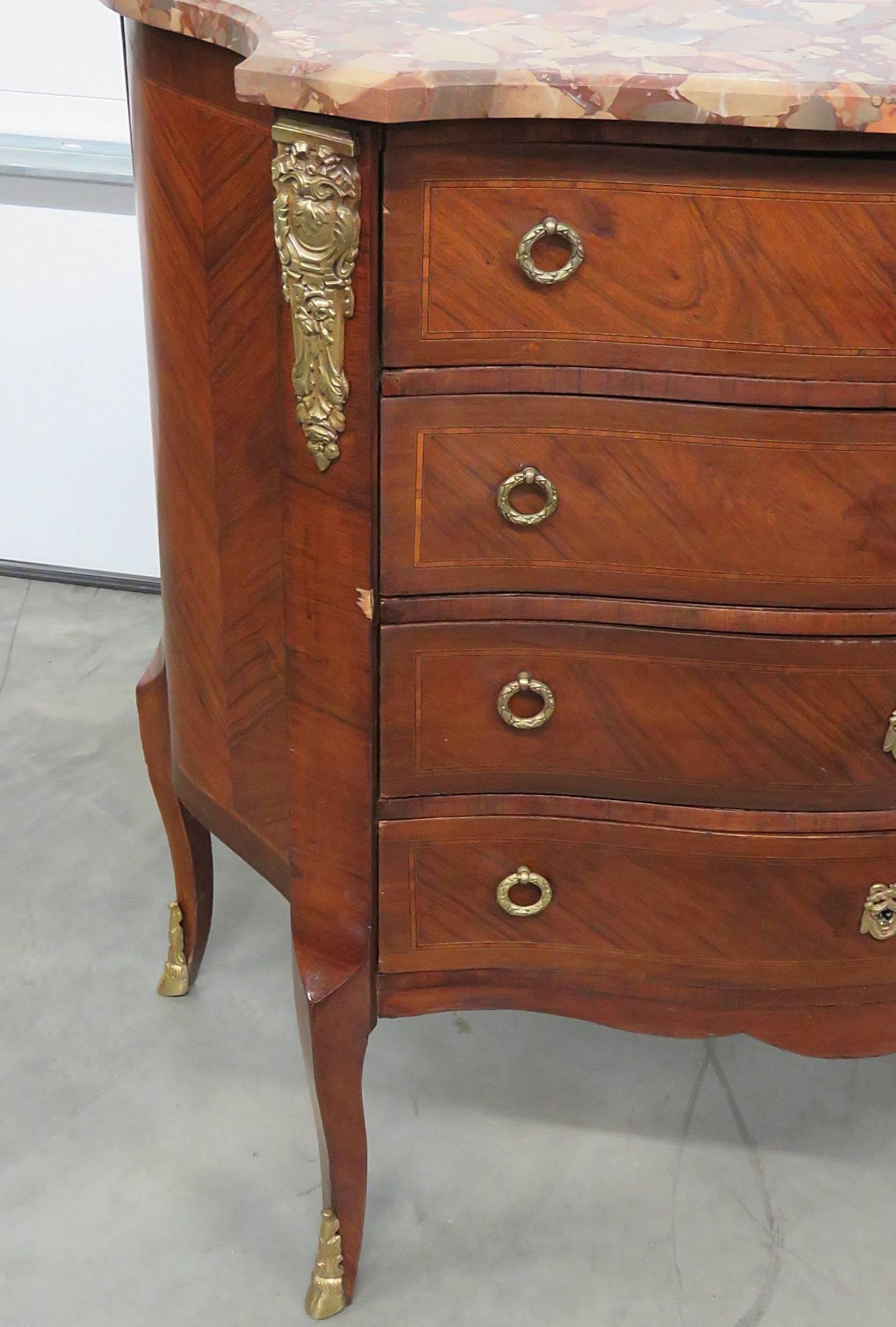 19th century Jansen style marble-top commode. Four drawers with bronze accents.