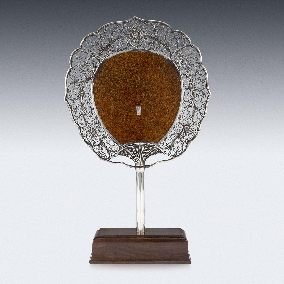 Antique late 19th century Japanese Meiji period solid silver mounted shibayama fan on stand. Of traditional Japanese fan-shape, with a central gold lacquer roundel inlaid in mother of pearl and coral with a three beautiful geisha dancing, playing