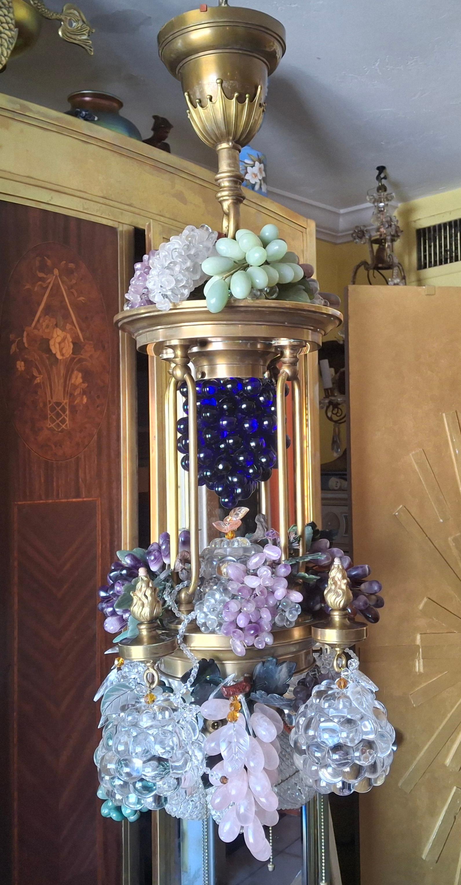 Monumental 19thc Art Nouveau Bronze and Brass with Amethyst/ Pink/ Green and clear Quartz Grape cluster Chandelier. Very high quality Chandelier in every way! 9 lights, 4 perimeter in the crystal clear Grape Globes, 4 bottom lights with beaded cut