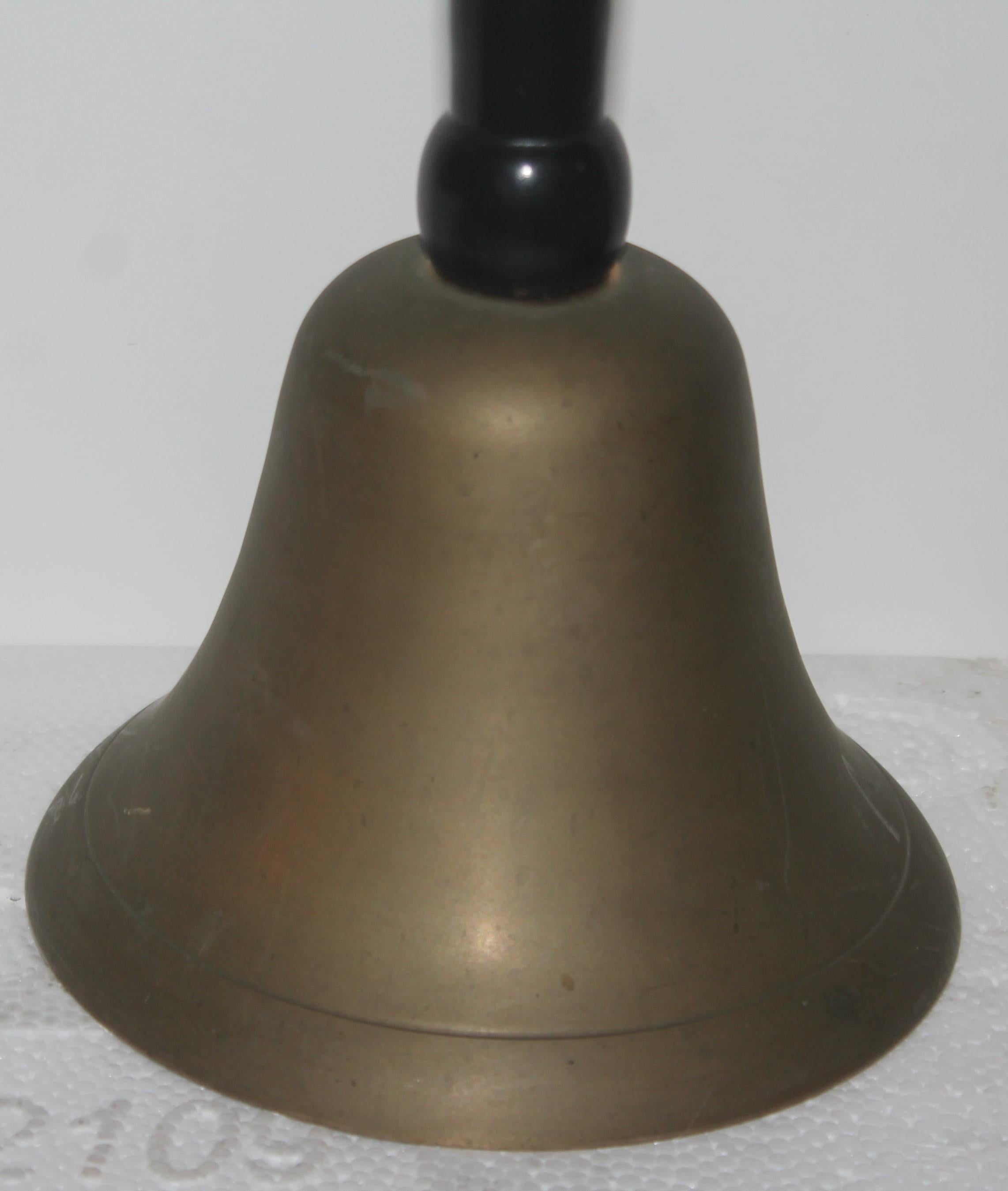 This large 19th century brass dinner or school bell is in fine condition and rings like a school bell.