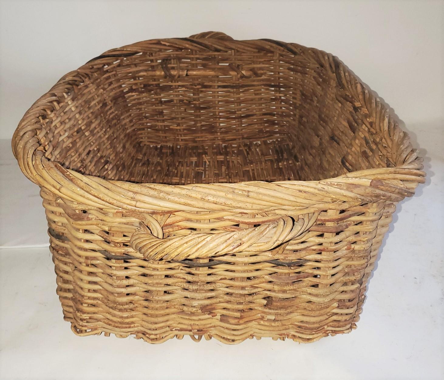 This fantastic double handled basket is in good condition and could handle a bunch of fruit or bagged bread. The condition is very good. A great display piece for a kitchen or retail store. In very nice condition.