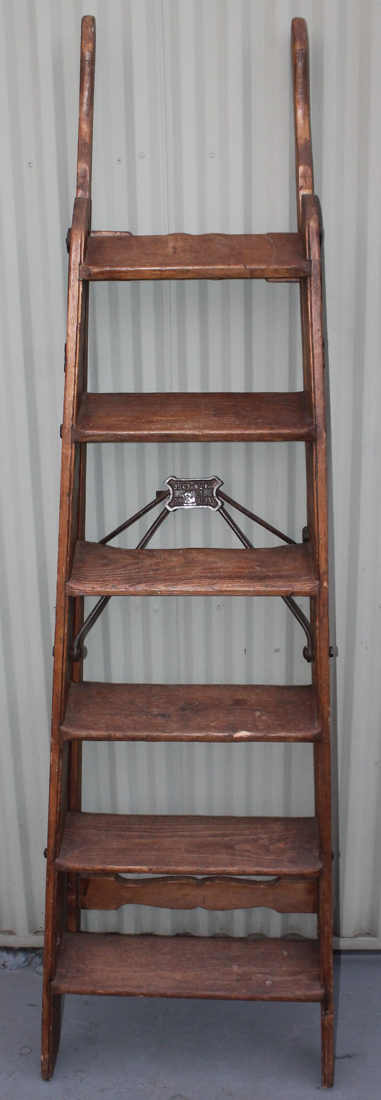 This fine 19th century library folding ladder in fine as found condition. Great for a vintage clothing store or vintage textile store.Fine cut outs and details.
Simplex ladder
Selfacting stop
Patent number 6956.