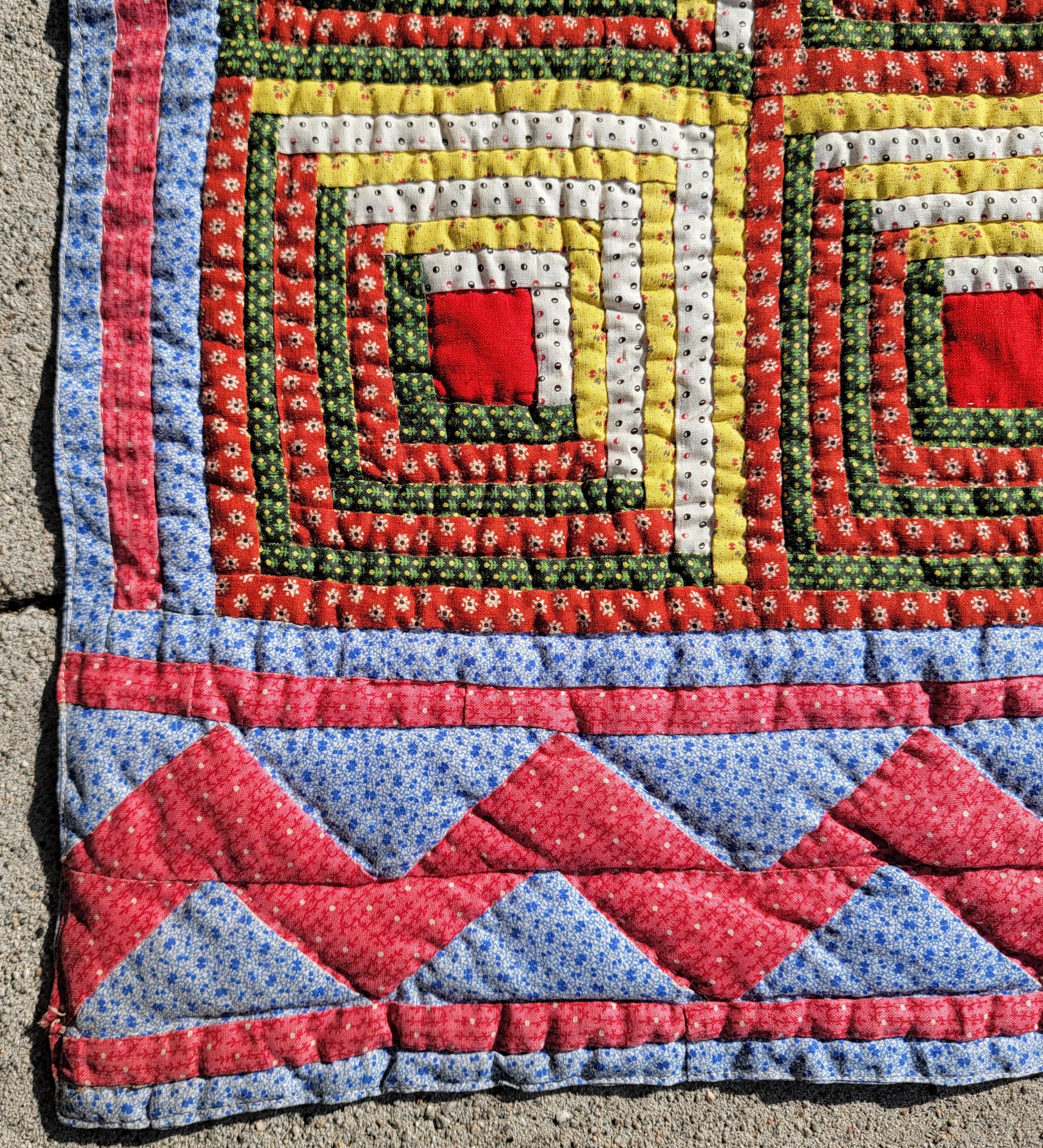 19thc log cabin barn raising quilt with zig zag border in pristine condition. This amazing log cabin quilt looks like the logs are stuffed.It has an amazing three dimensional look. This quilt was found in Lancaster County, Pennsylvania.