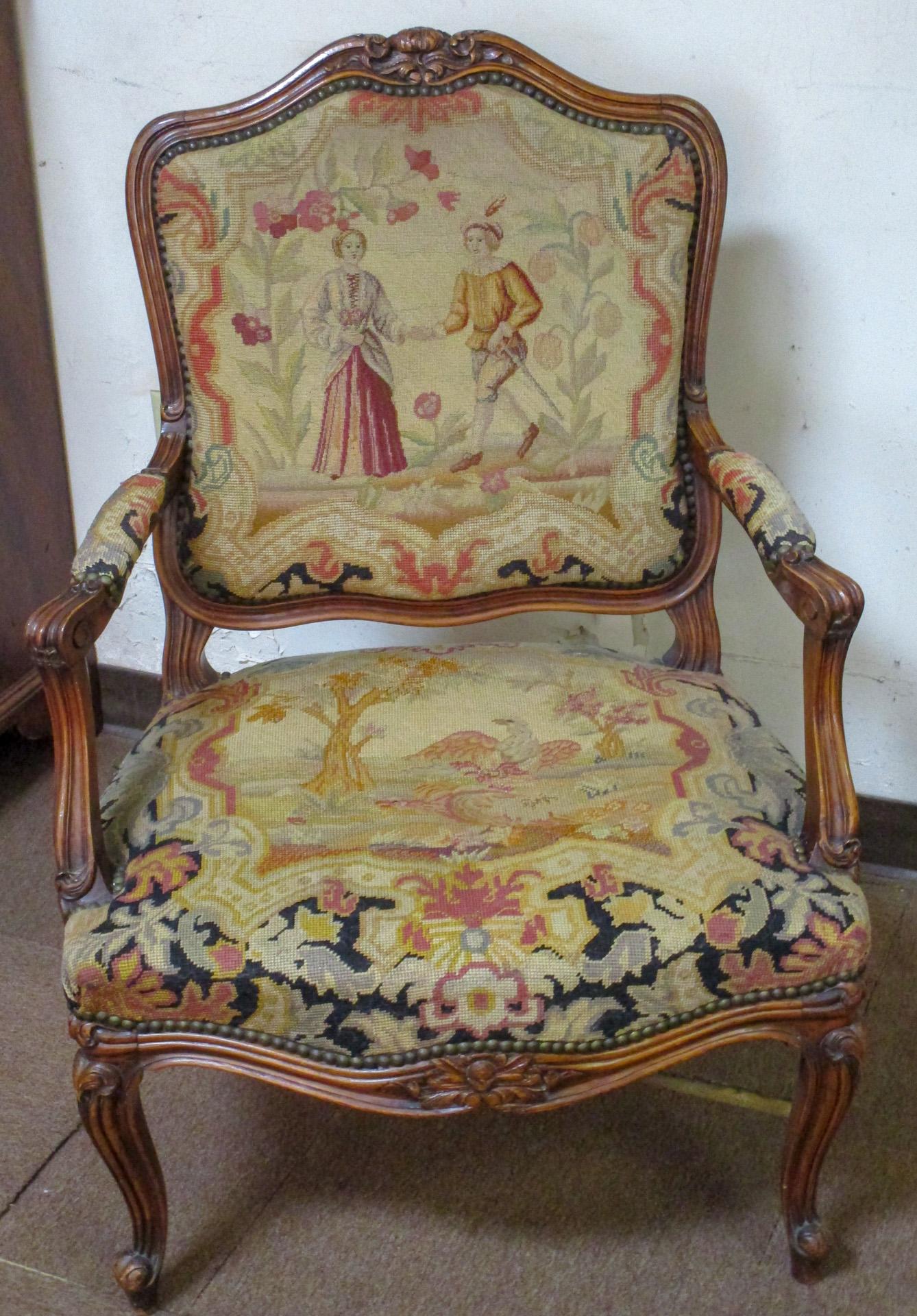 This lovely pair of fauteuils with carved wood frames feature a combination of needlepoint and petite point upholstery with brass nail head trim. If you look closely they are each a little different- but each elaborately carved with serpentine
