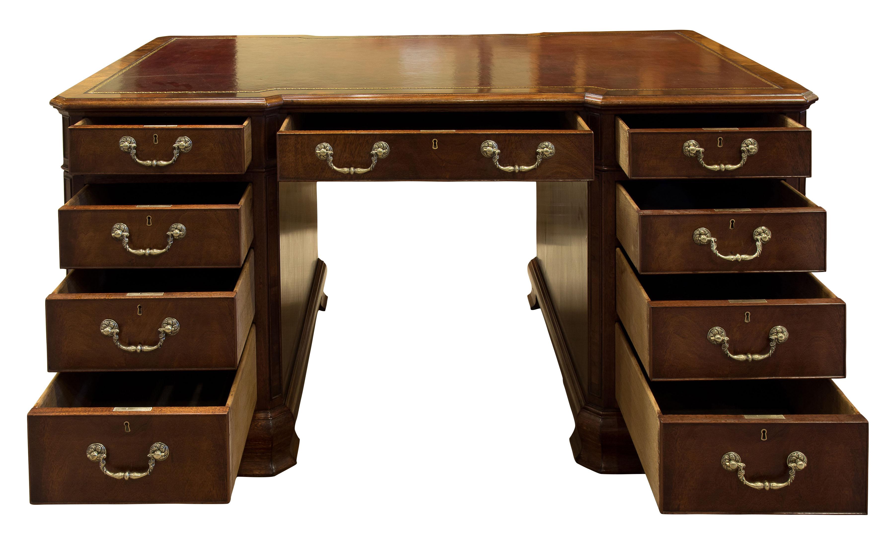 19th century mahogany desk. Inverted breakfront with canted corners shaped bracket feet with skirting reveal. Hand dyed and tooled leather insert,

 

circa 1880.
