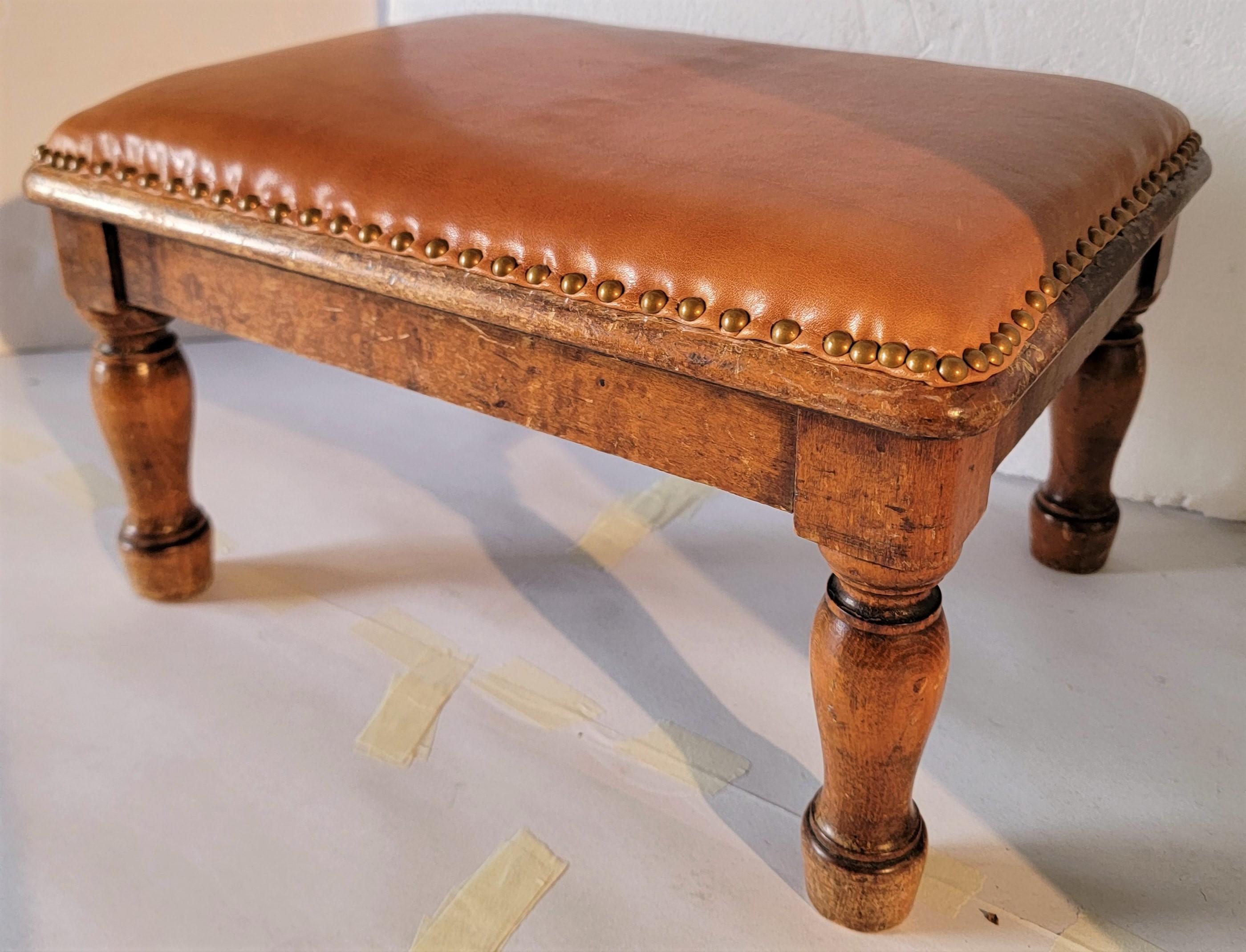 19thc Maple foot stool with a leather top ( newly upholstered ) with brass tack trim & fine vintage leather.This stool is very sturdy and in fine condition.