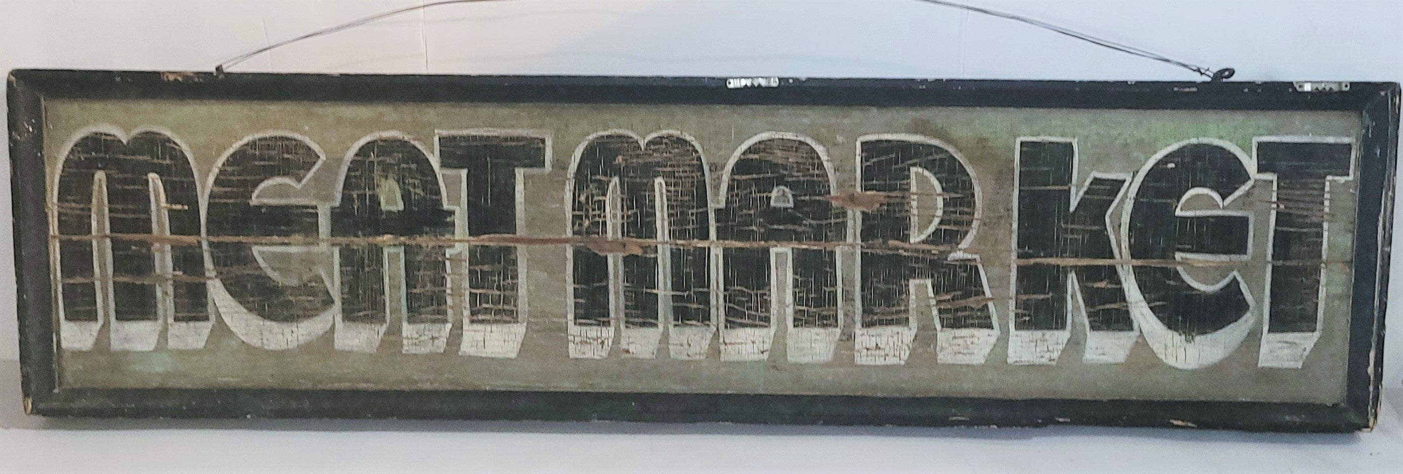 The patina is so wonderful on this 20thc Meat Market trade sign. The sign is in good used condition.There is a minor crack in the middle of the sign. This sign was found in Pennsylvania.It is a double sided sign. This sign was used in Lancaster