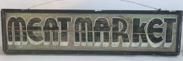 The patina is so wonderful on this 19thc Meat Market trade sign. The sign is in good used condition.There is a minor crack in the middle of the sign. This sign was found in Pennsylvania.It is a double sided sign.