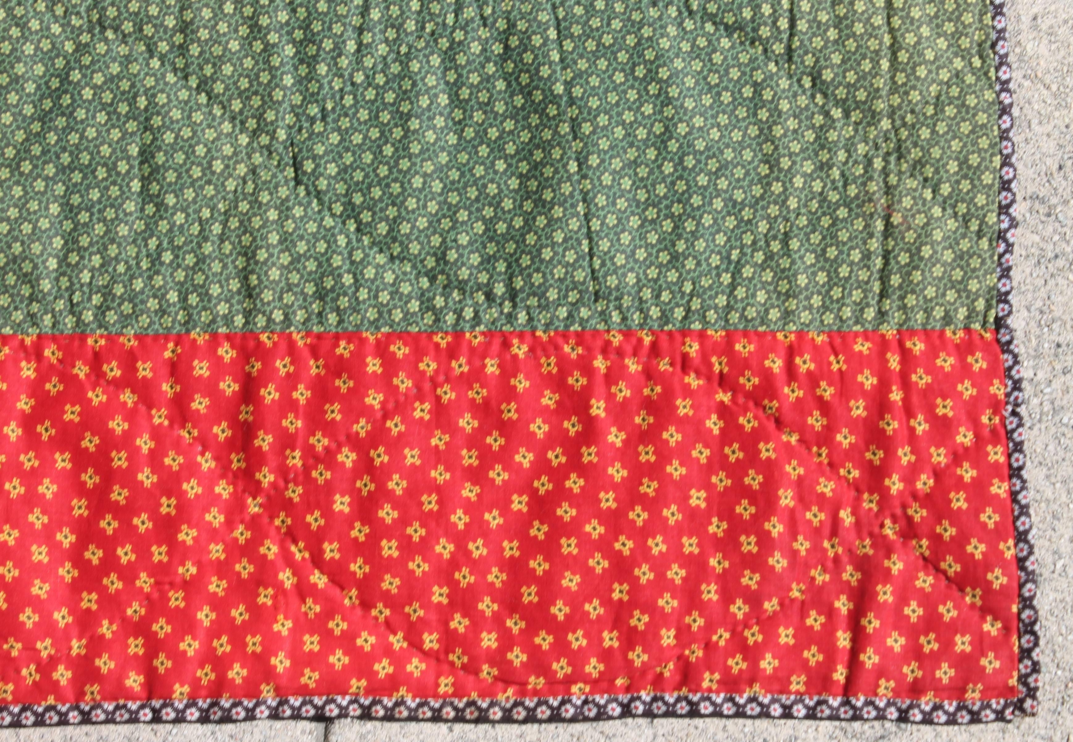 19th century Mennonite bars quilt red and green bars quilt. The condition is very good and crisp. This quilt is very pristine with no fade or damages.