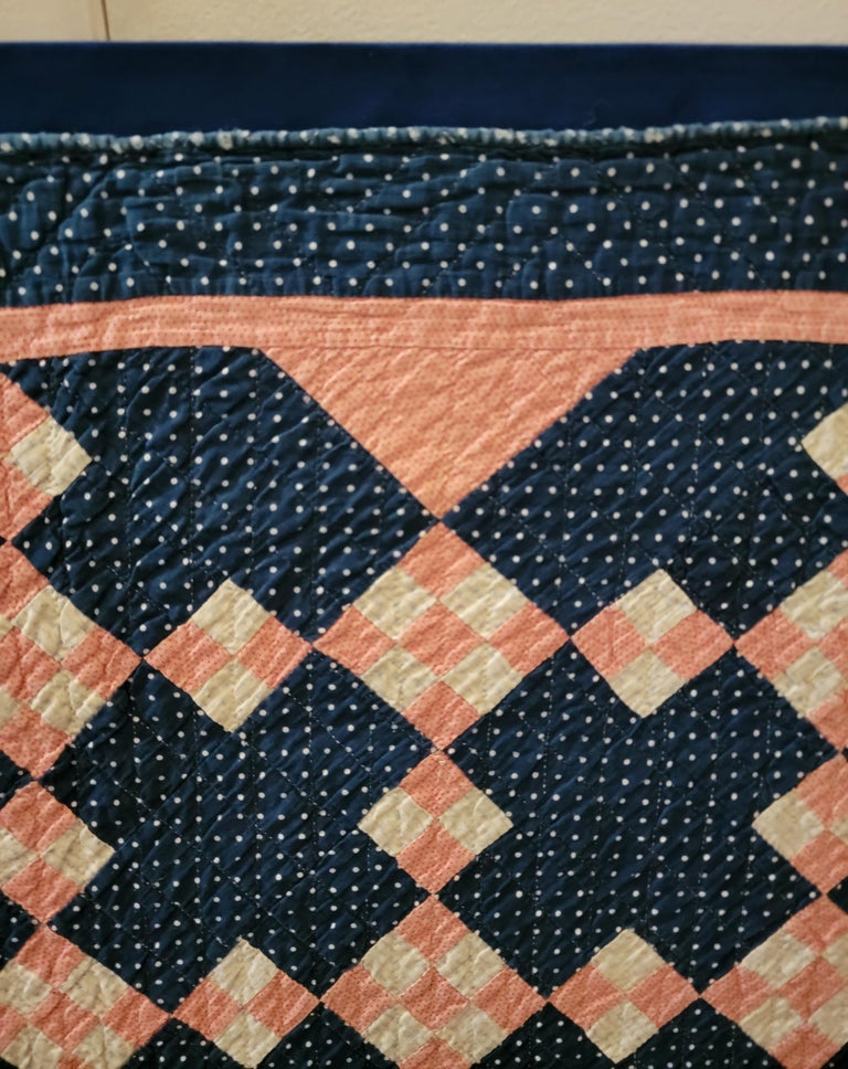 This fine tiny pieced  19thc postage stamp chain crib quilt on indigo blue calico ground and pink calico blocks with white calico blocks is in fine condition.This Pennsylvania beauty is a real gem for a quilt collector or folk art collection. It is