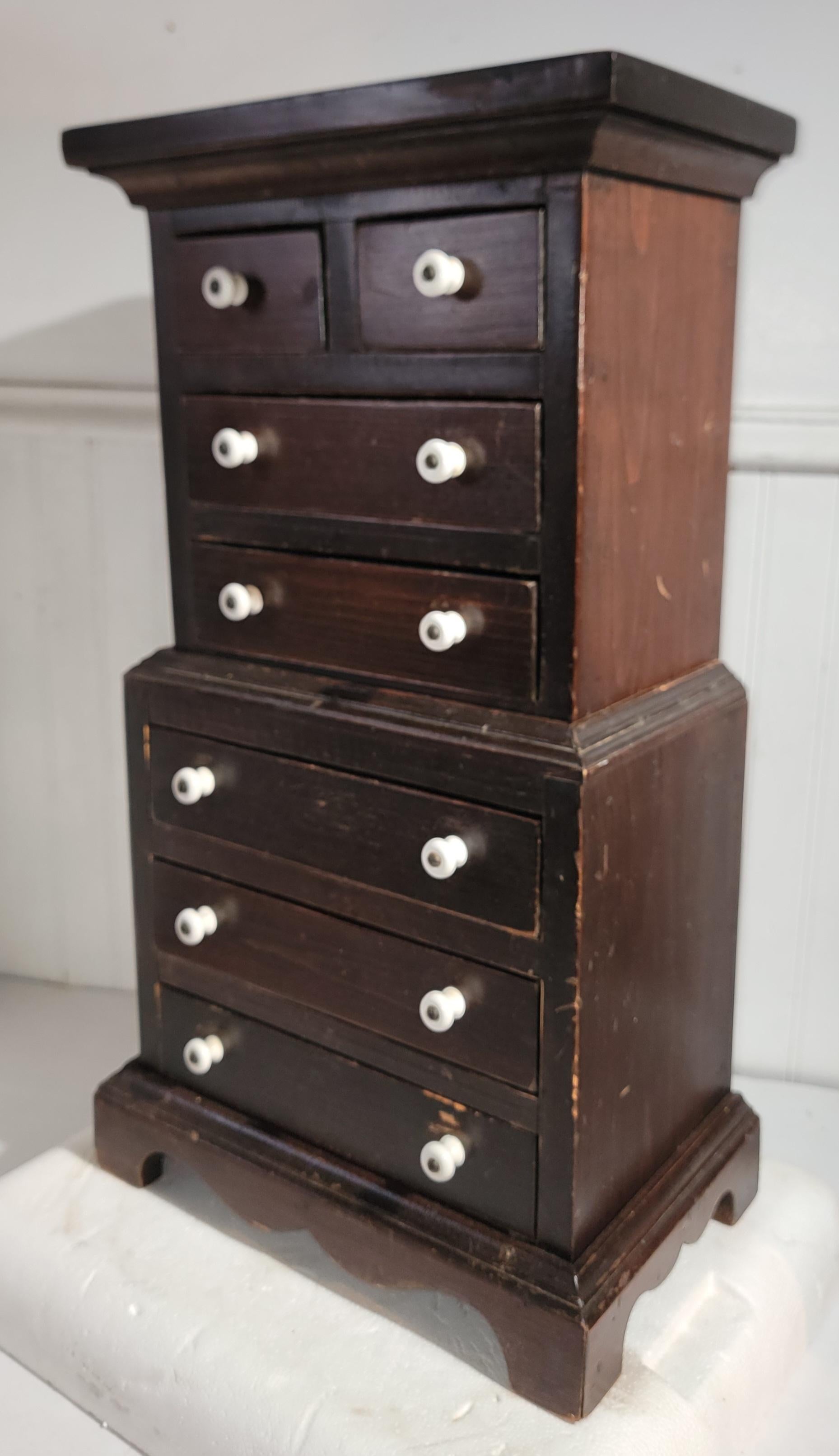 Amazing two pcs. child's step back cupboard with original hardware & ironstone or porcelain knobs or drawer pulls.This is in old surface & amazing patina.