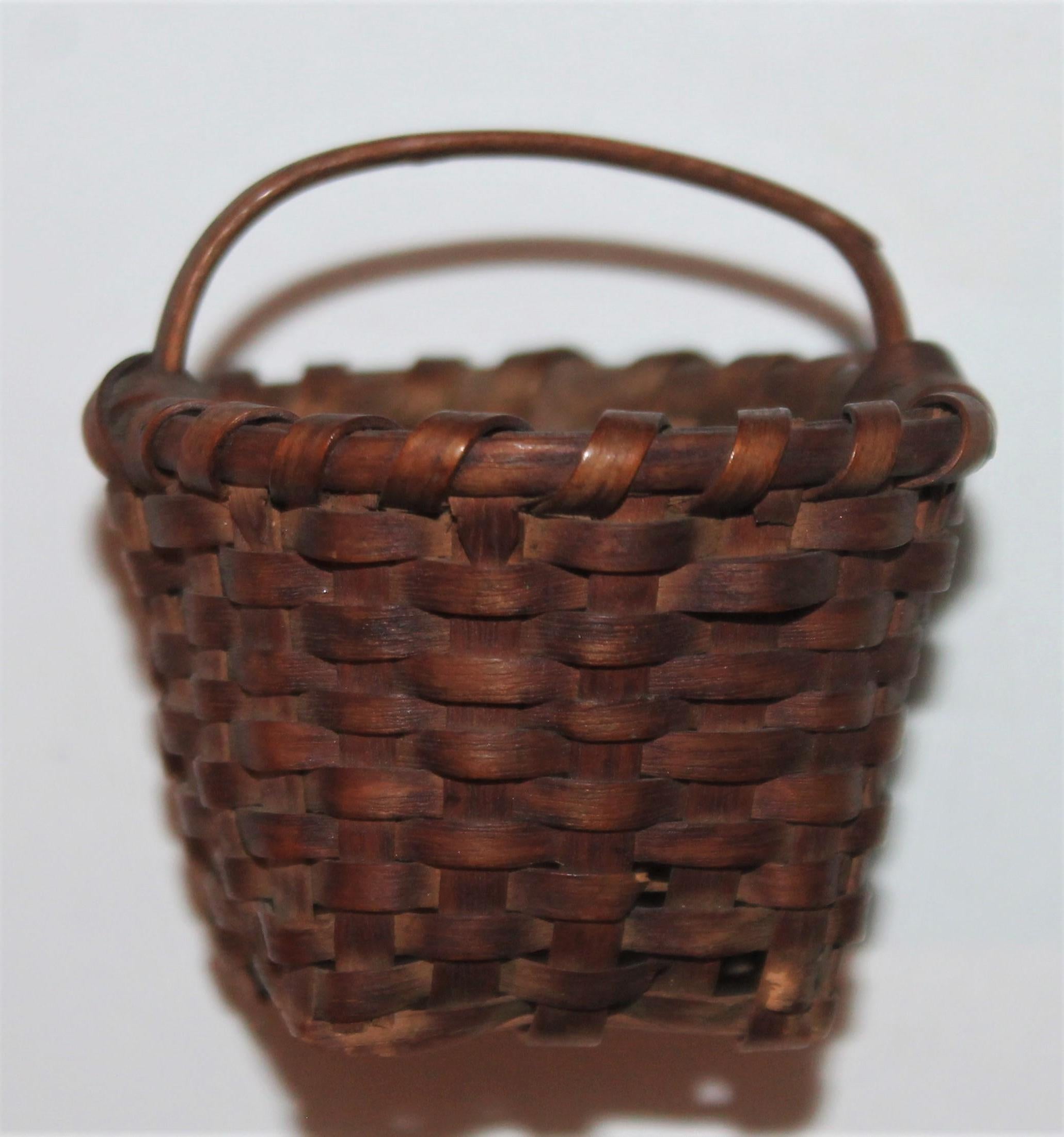 This fine 19th century old surface tiny basket is in amazing as found condition. The scale is unbelievable.