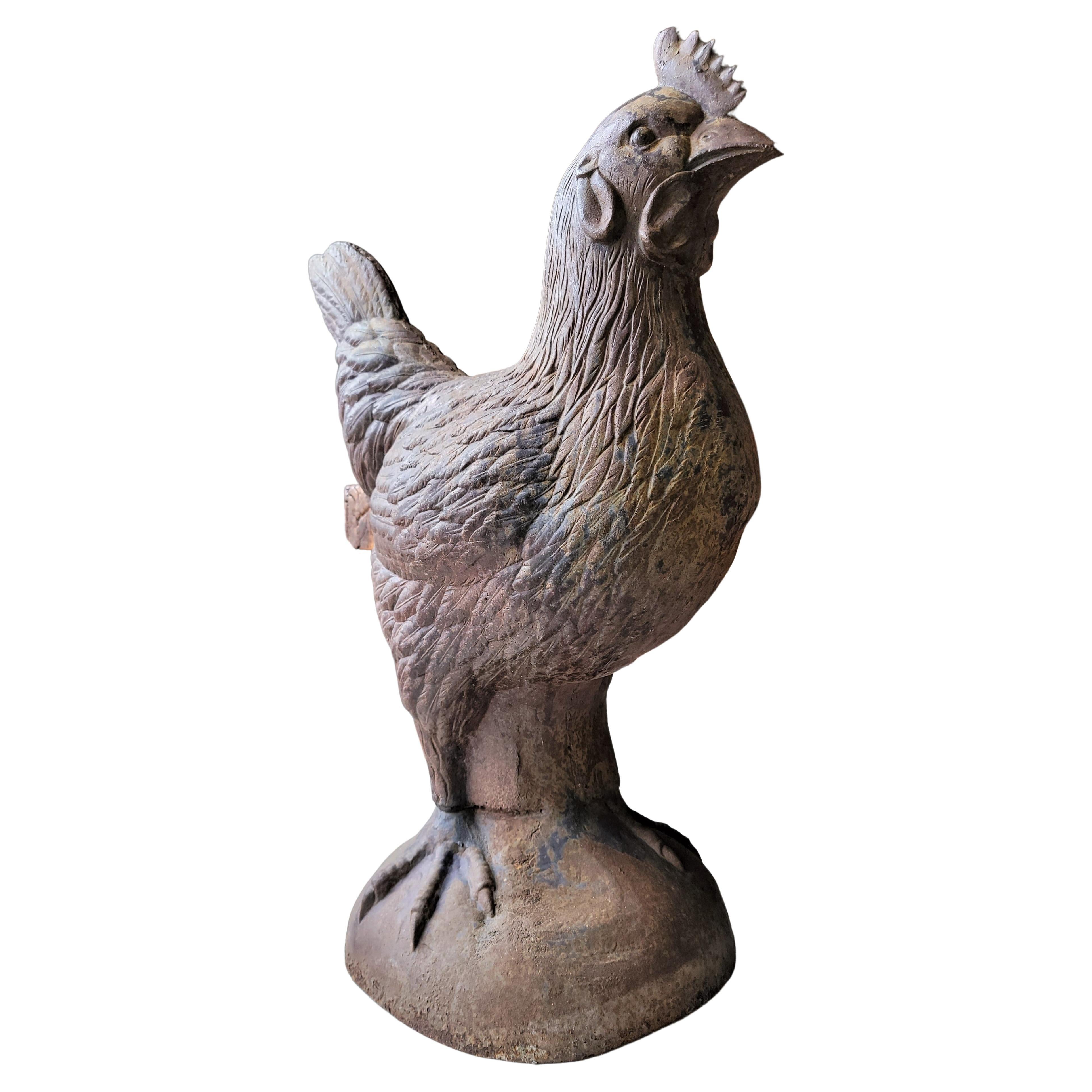 This fantastic monumental cast iron rooster is very large and heavy. It was probably used in a store front as a trade sign or a garden element. The patina is amazing and in very good condition.