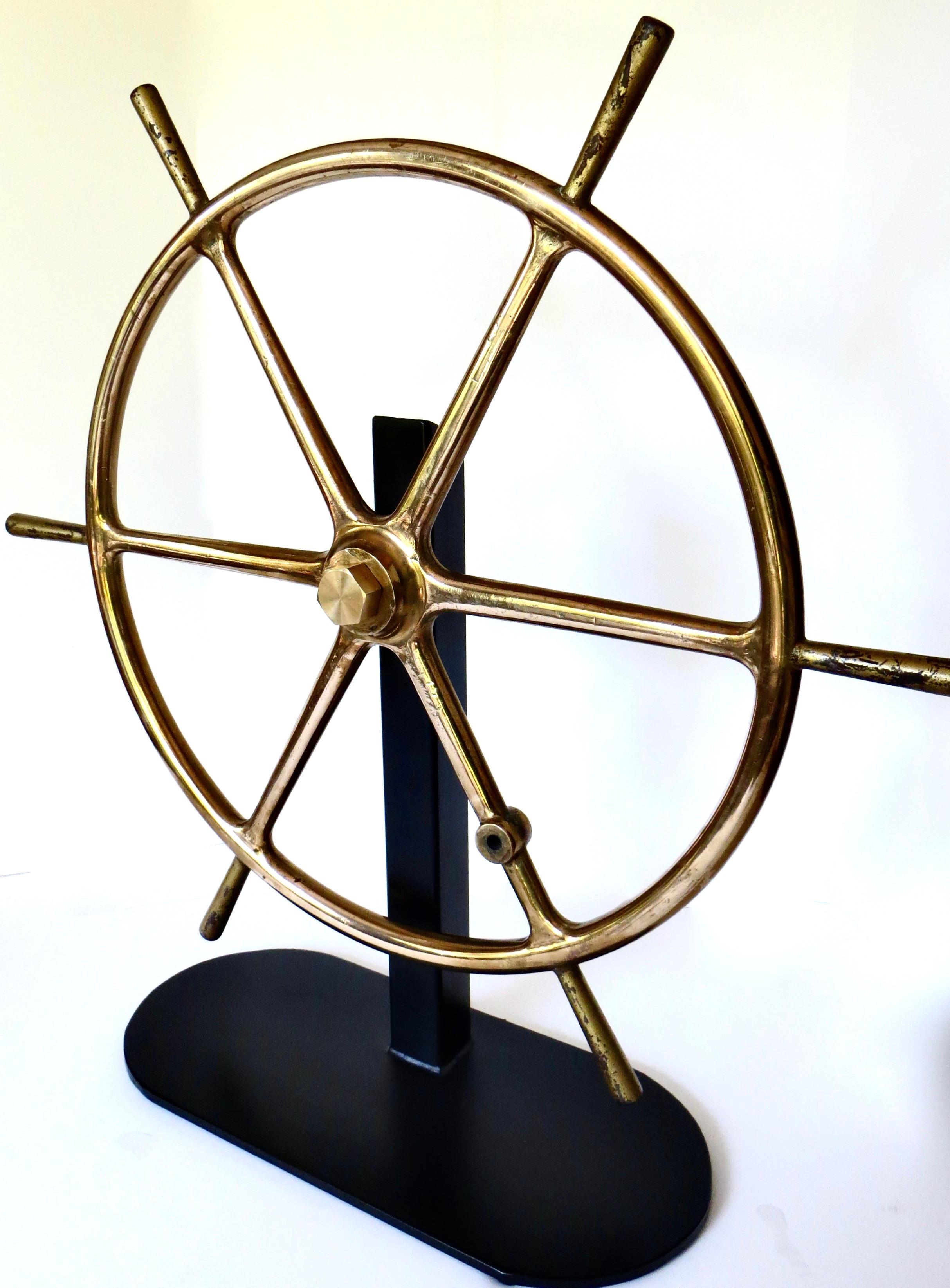 This 19th century American solid brass ship steering wheel was, more than likely, from a yacht. Fishing and commercial boats were more inclined to use cast iron and/or wood; the brass adds an element of luxury. It has a fair amount of weight to it,