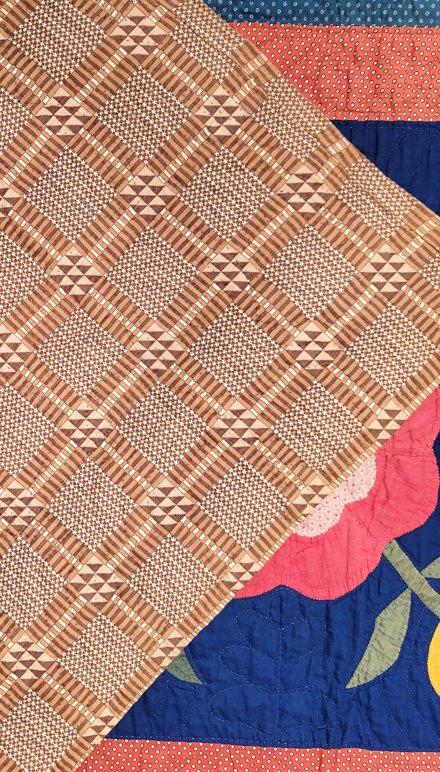 This amazing 19thc tulip applique quilt is most unusual with a indigo blue cotton back round fabric.Photo is not true as there is no fade in this border.Fine piecing & quilting.