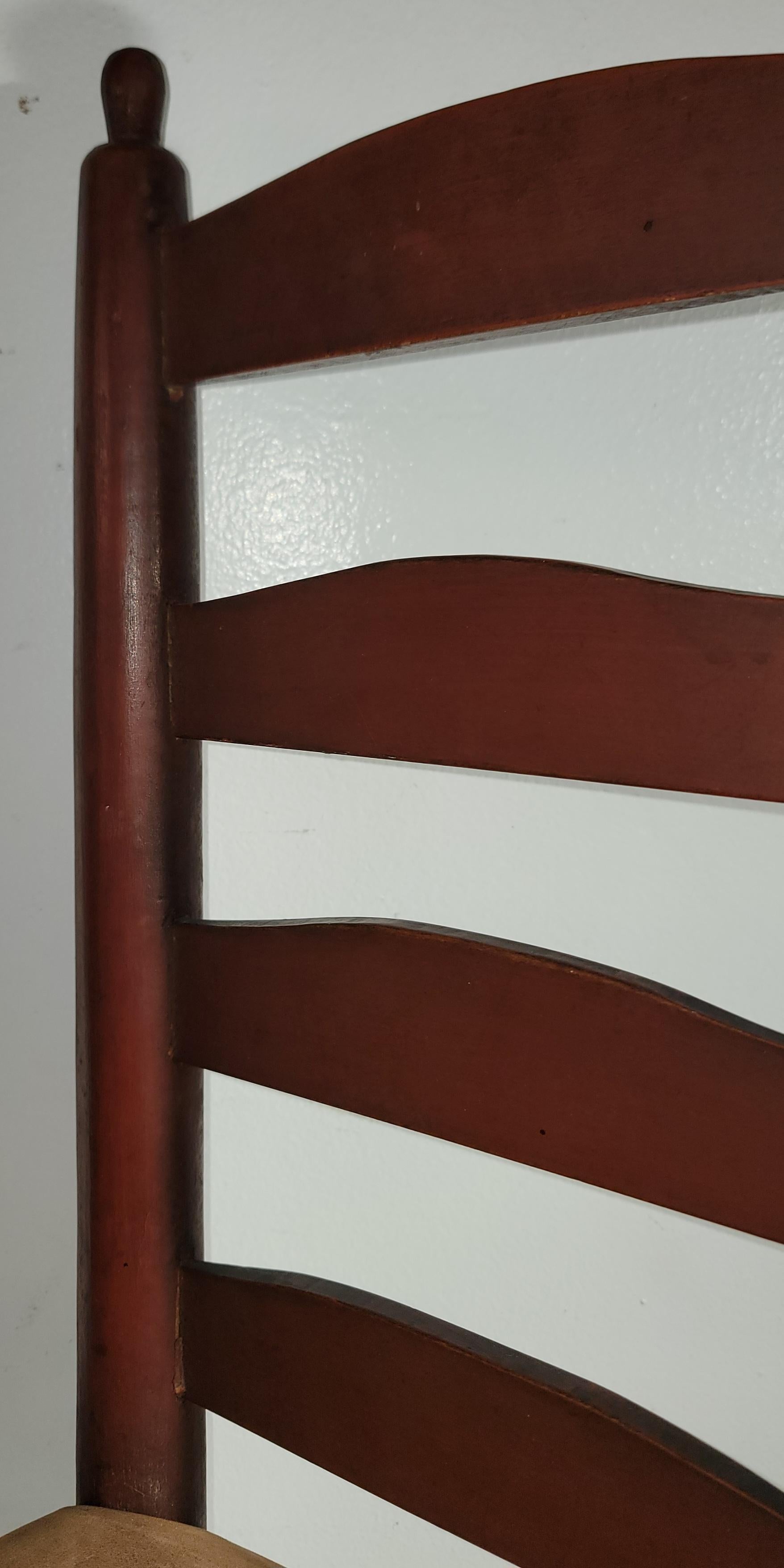 19Thc Original red painted children's ladder back chair with suede seat. The condition is very good and sturdy.