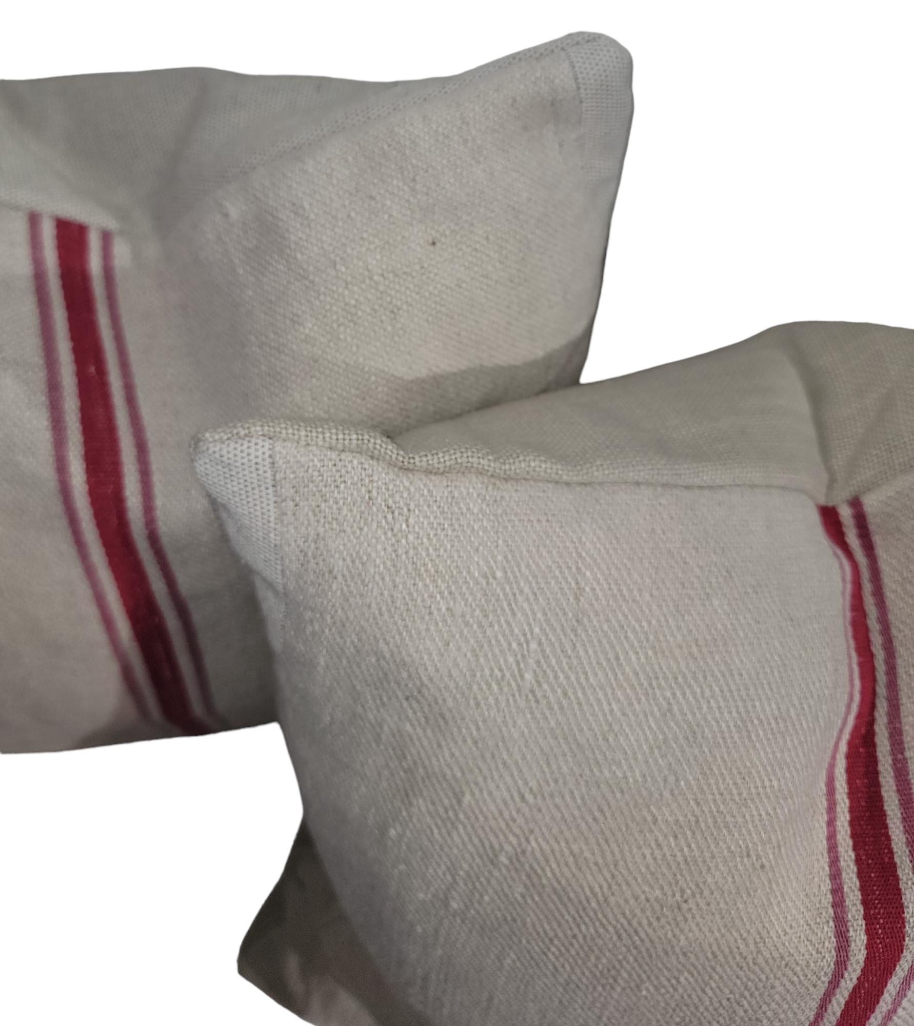 Vintage all linen pillows made from a cotton linen fabric found in a New England collection with beautiful red stripe down the middle. Neutral colors with a strong vibrant stripe. Down and feather filled insert. 
